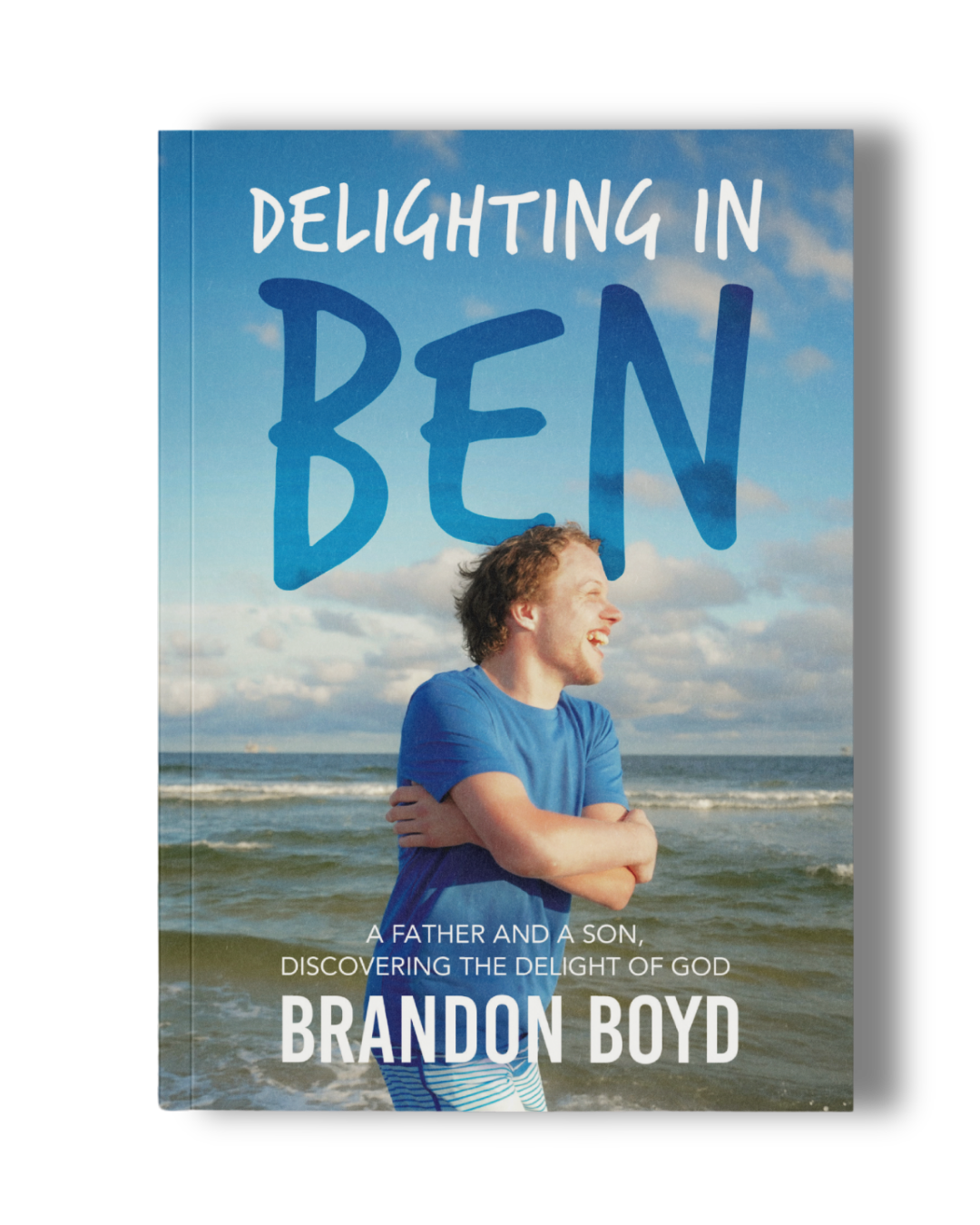 Book cover titled "Delighting in Ben" by Brandon Boyd, featuring a young man in a blue shirt smiling and standing on a beach.
