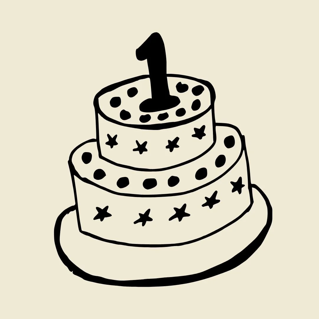 Black and white drawing of a three-tiered birthday cake with star and dot decorations and a single candle on top.