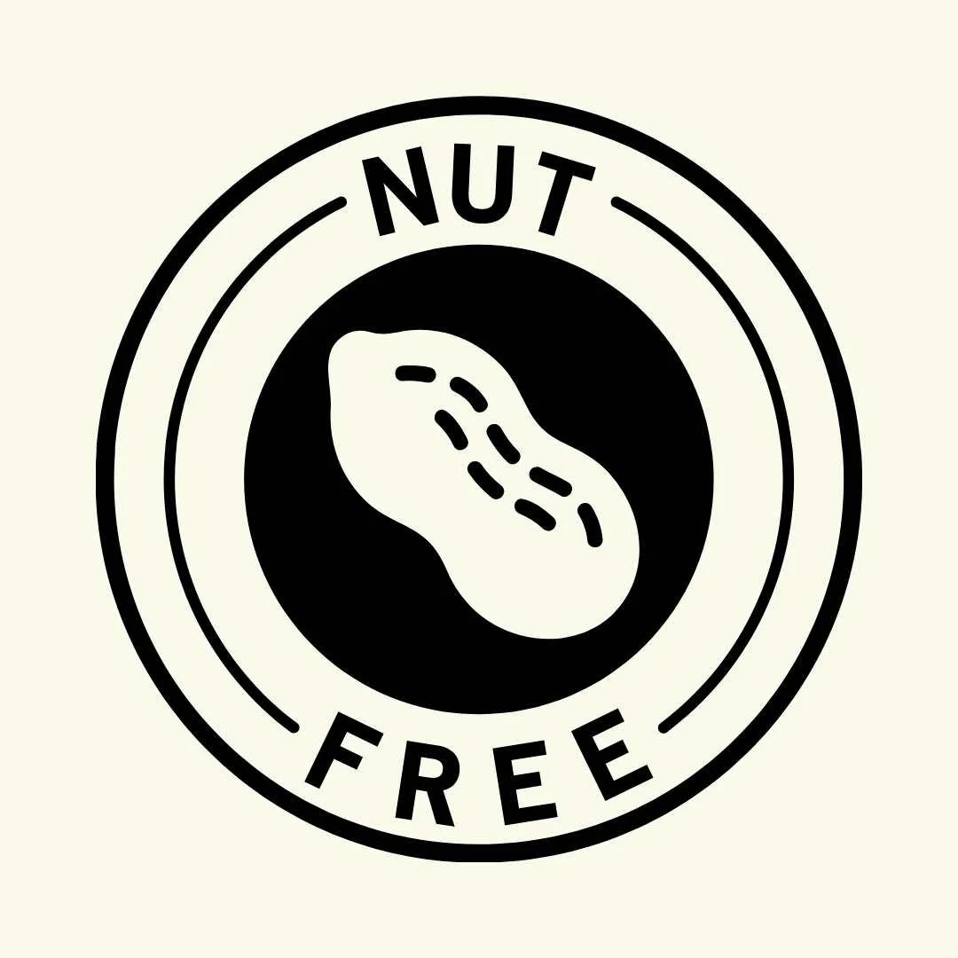 A circular logo with a peanut silhouette in the center, and the words 'NUT FREE' around it.
