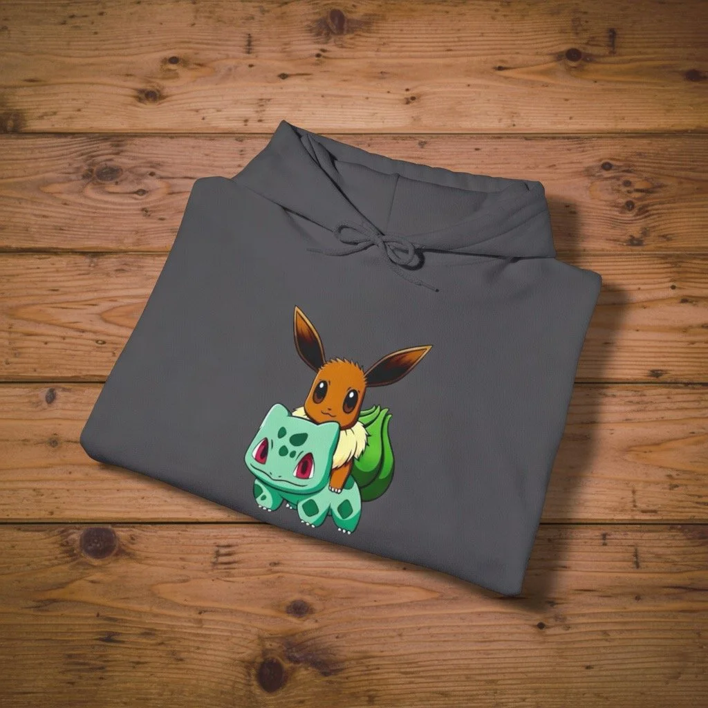 Gray hoodie with aCute Brown Fox Riding Green Plant Dinosaur, placed on a wooden surface.