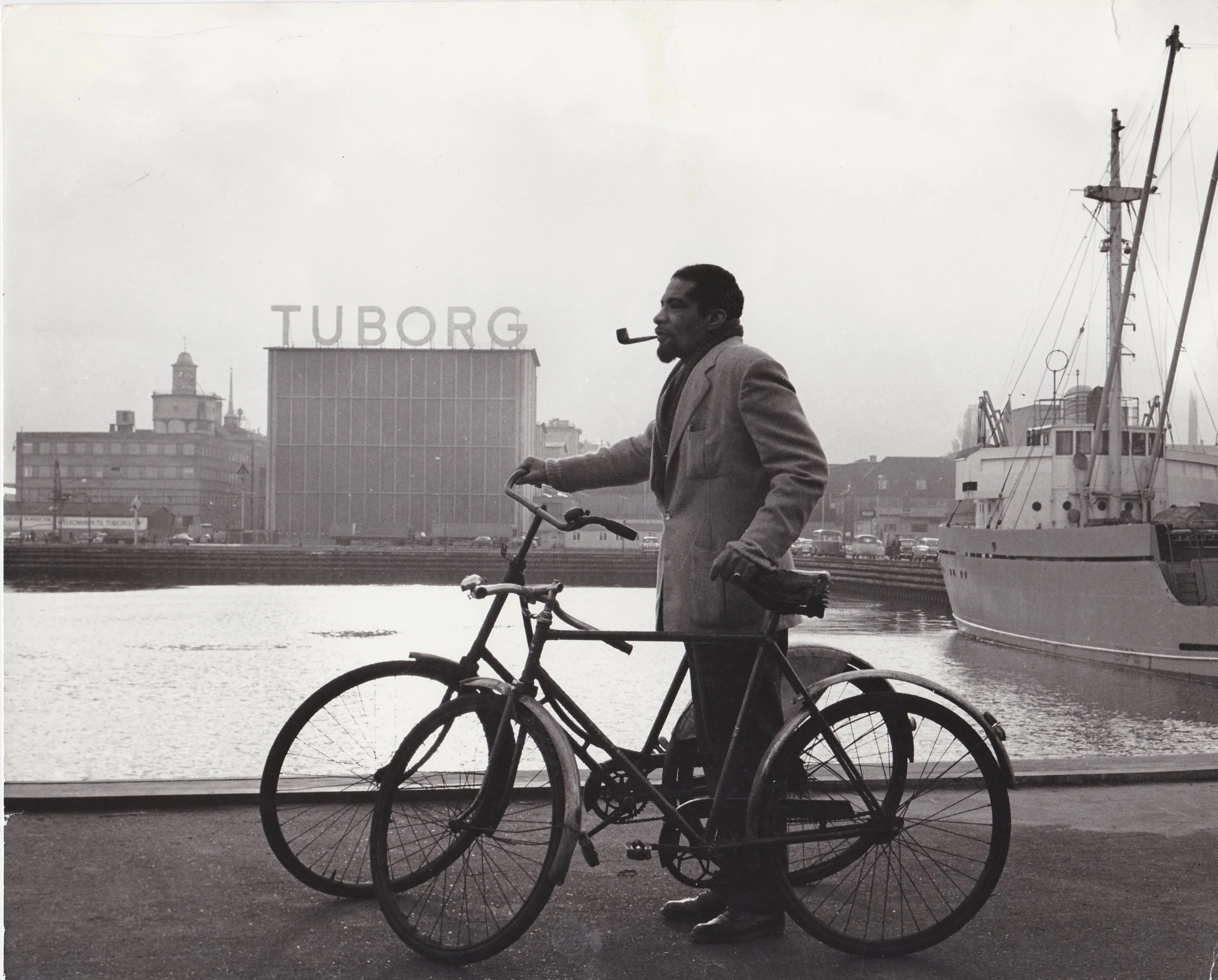 Copy+of+_TIMELINE+5+MID-CAREER+Herb+with+bikes+in+Copenhagen+(Tuborg+beer+factory+across+waterway)1960-1963.jpeg