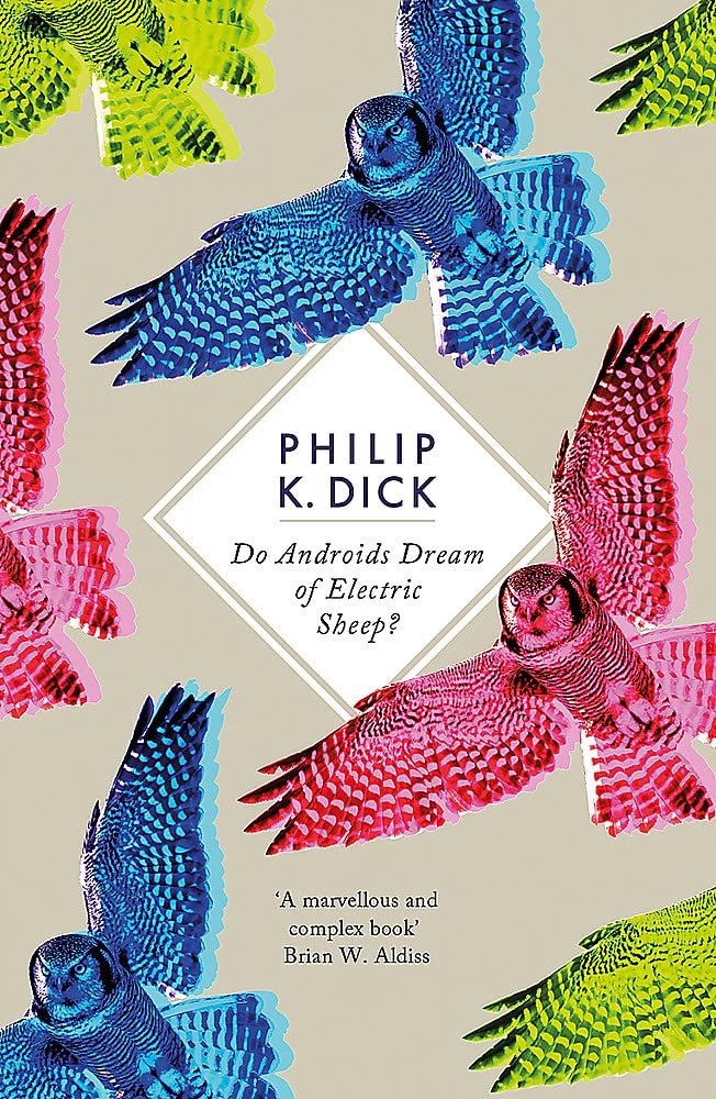 Book cover with colorful illustrations of owls in blue, pink, and green, around a white diamond-shaped frame containing the title 'Do Androids Dream of Electric Sheep?' by Philip K. Dick.