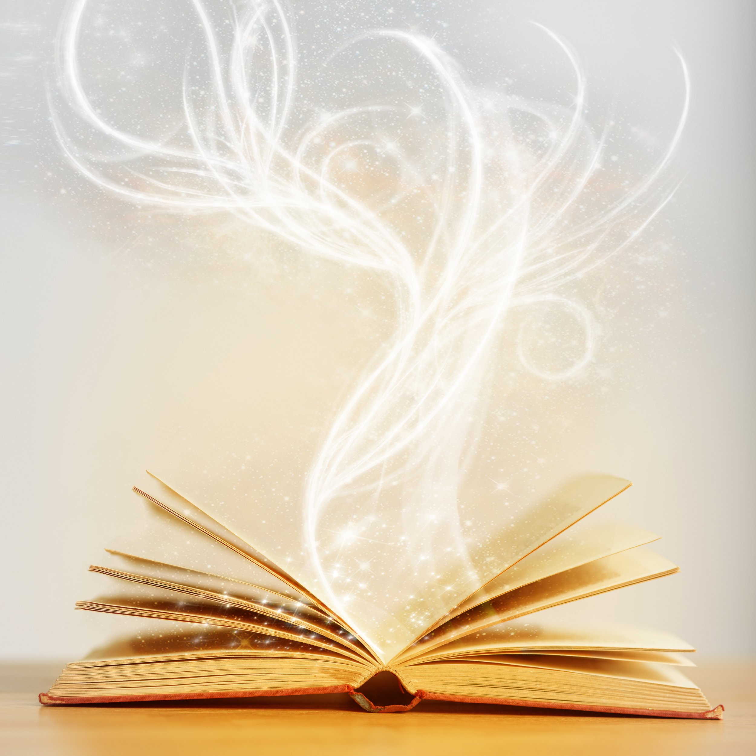 Open book with glowing, swirling, light effects emerging from pages, creating a magical or fantastical atmosphere.