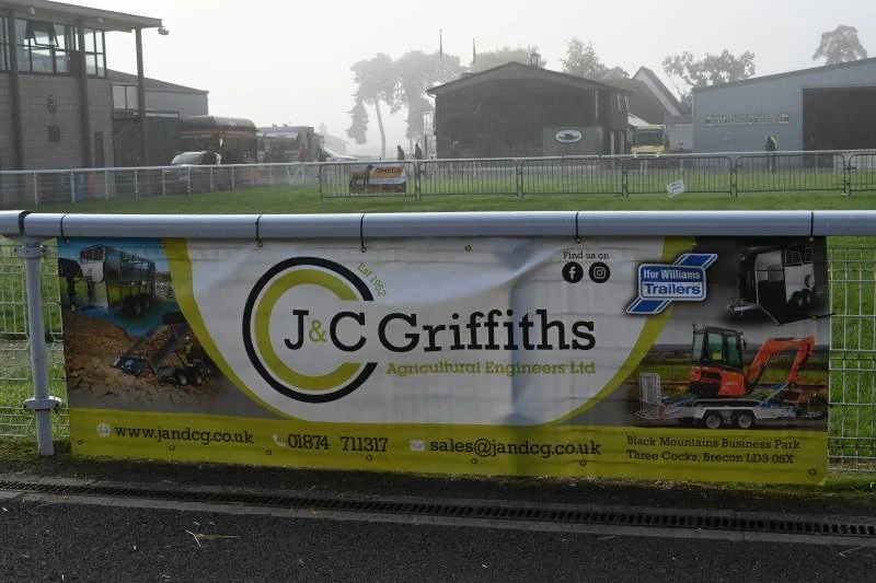 Banner for J&C Griffiths Agricultural Engineers Ltd. displaying images of construction and agricultural machinery, with contact information and location details.