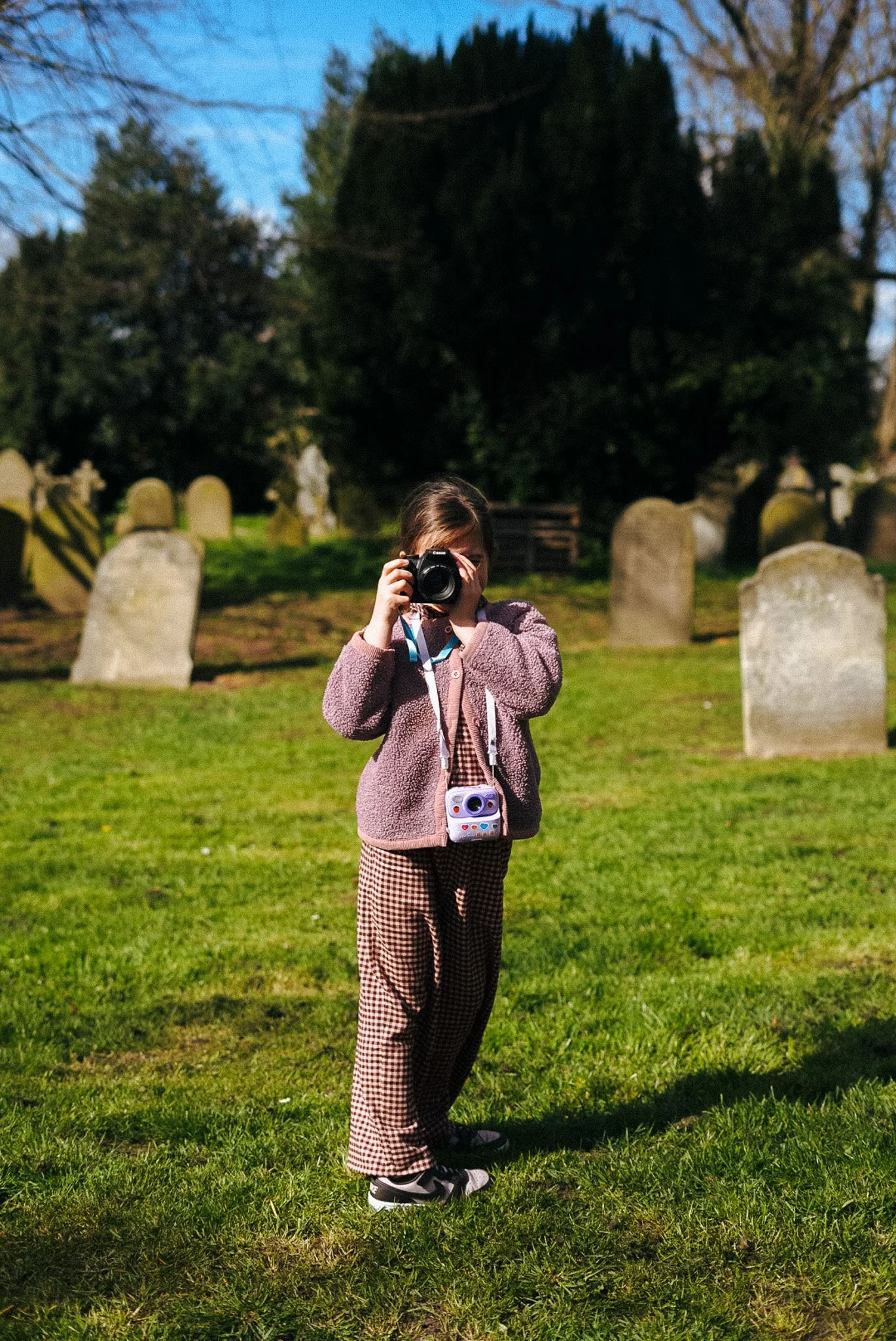 Child using DSLR camera