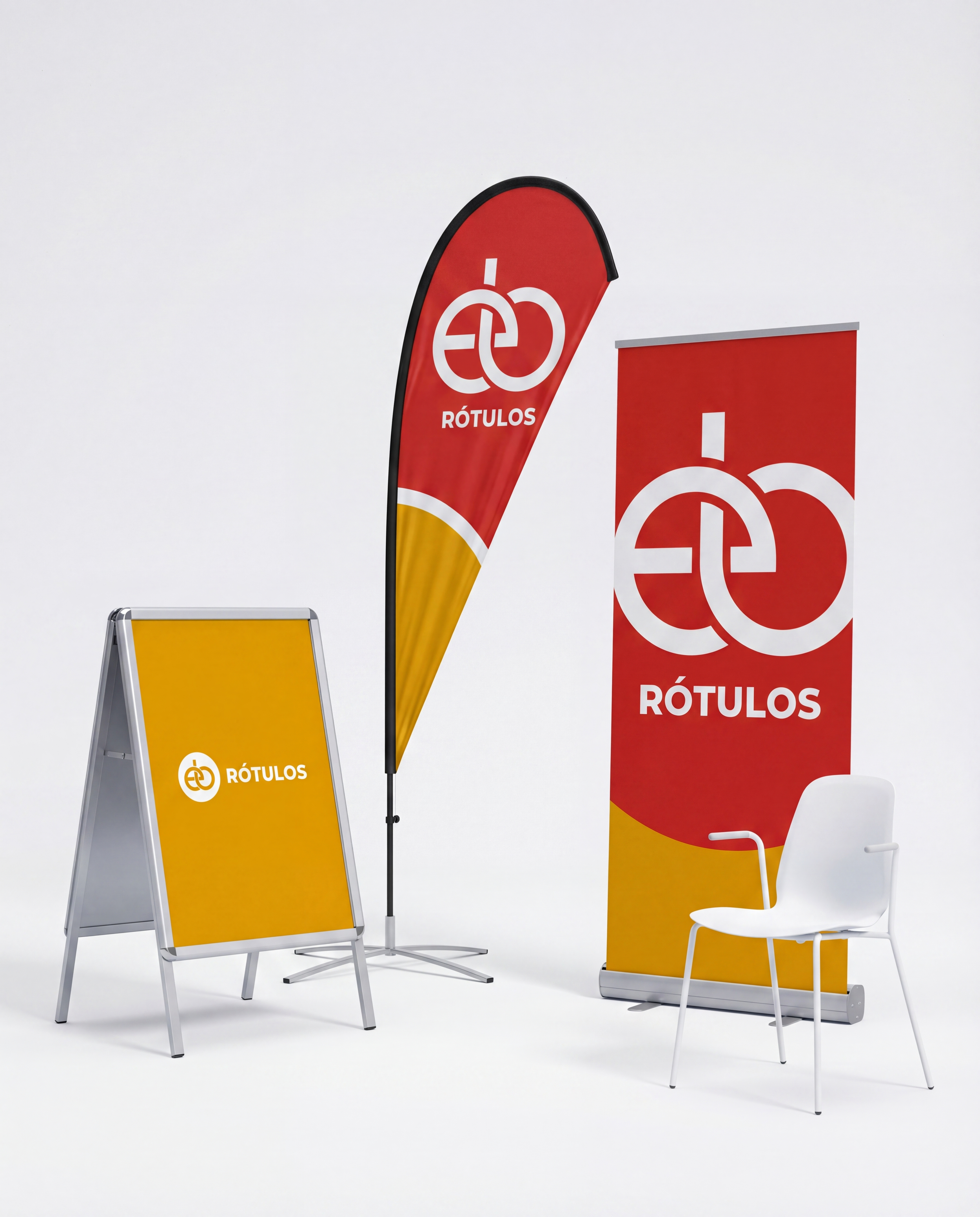 Se muestran pancartas, banderas y cartel con el logotipo y la palabra 'Rótulos' en colores rojo, amarillo y blanco, en un fondo blanco.