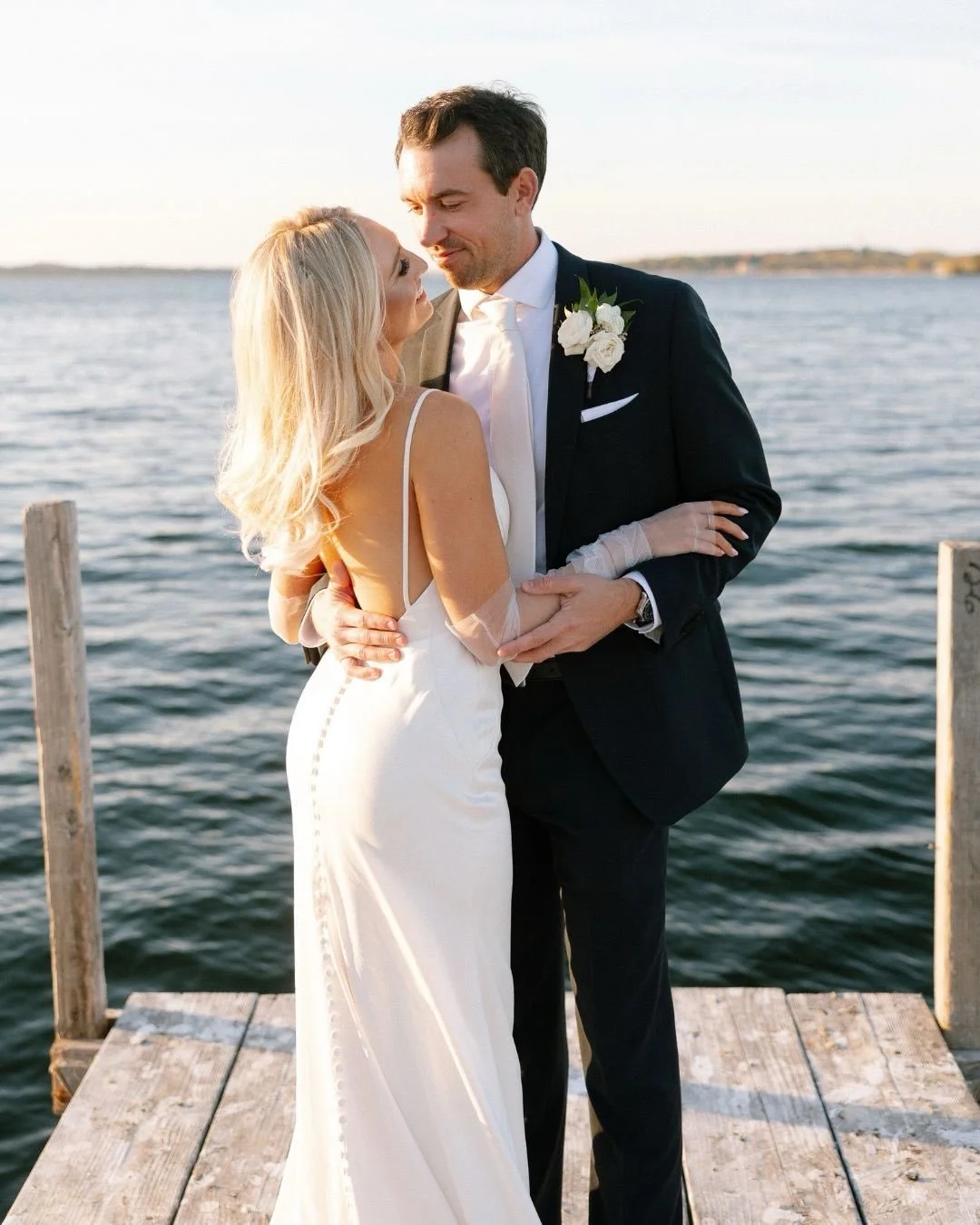Just married and fully in it. 

Golden light, a quiet dock, and that just-married kind of energy you can&rsquo;t fake. Running toward the next thing together, stopping for kisses, waving to whoever&rsquo;s watching, and hopping on a boat like it&rsqu