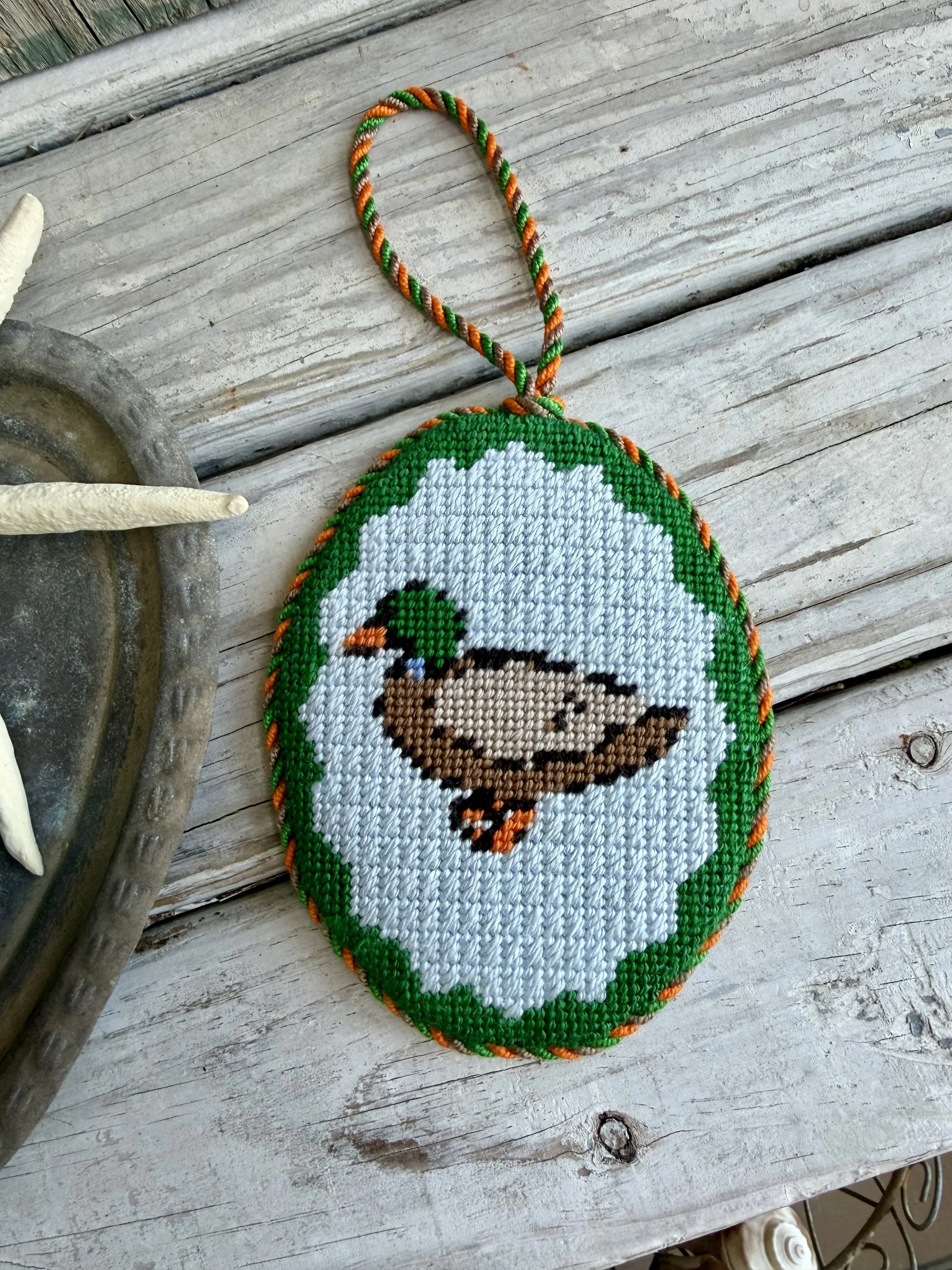 Oval Needlepoint Ornament with custom cording  - Finished by The Salty Stitchery