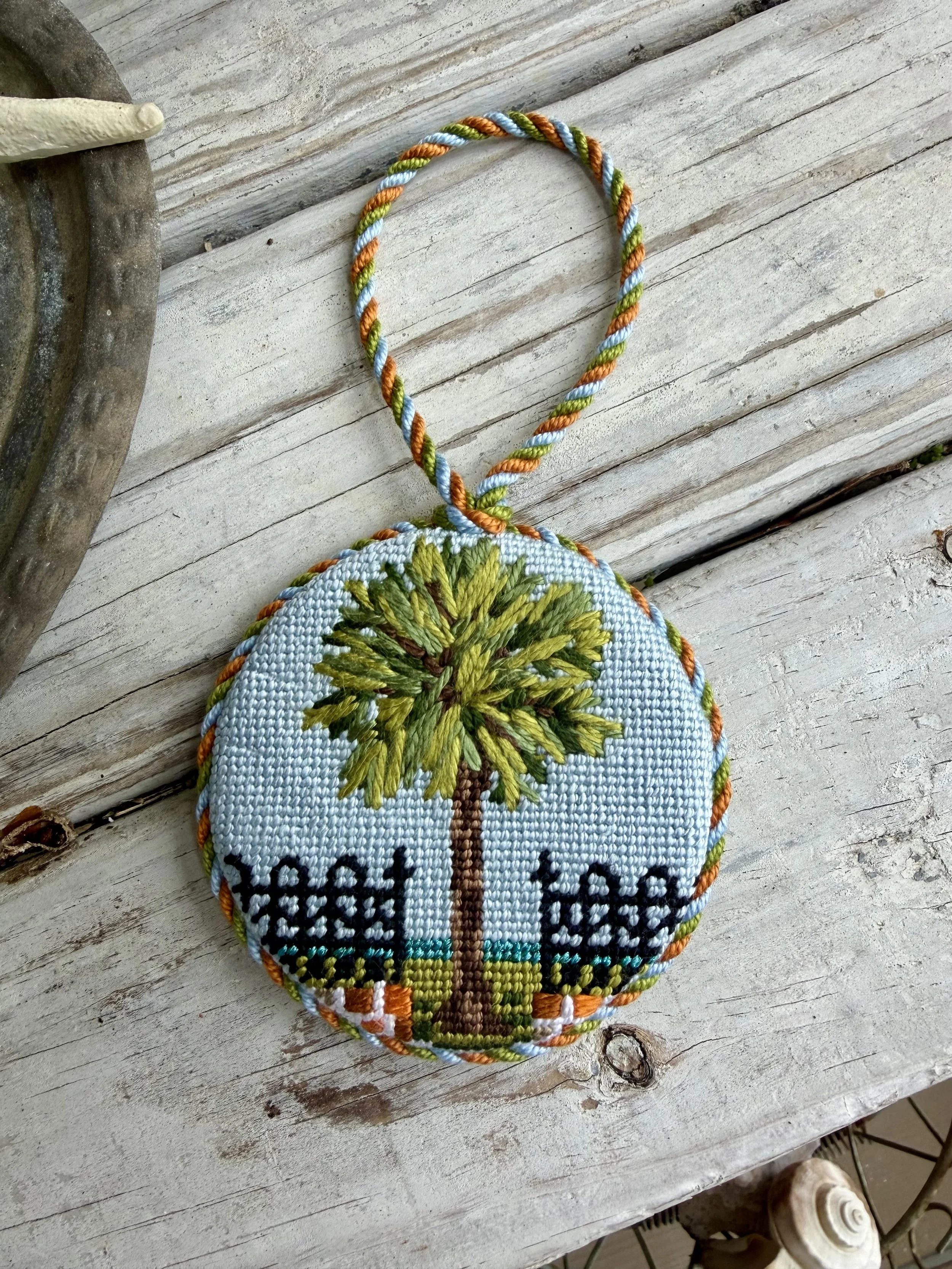 Round Finished Needlepoint Ornament with custom cording. Charleston Image with iron gate and Palm tree hand stitched Finished with The Salty Stitchery