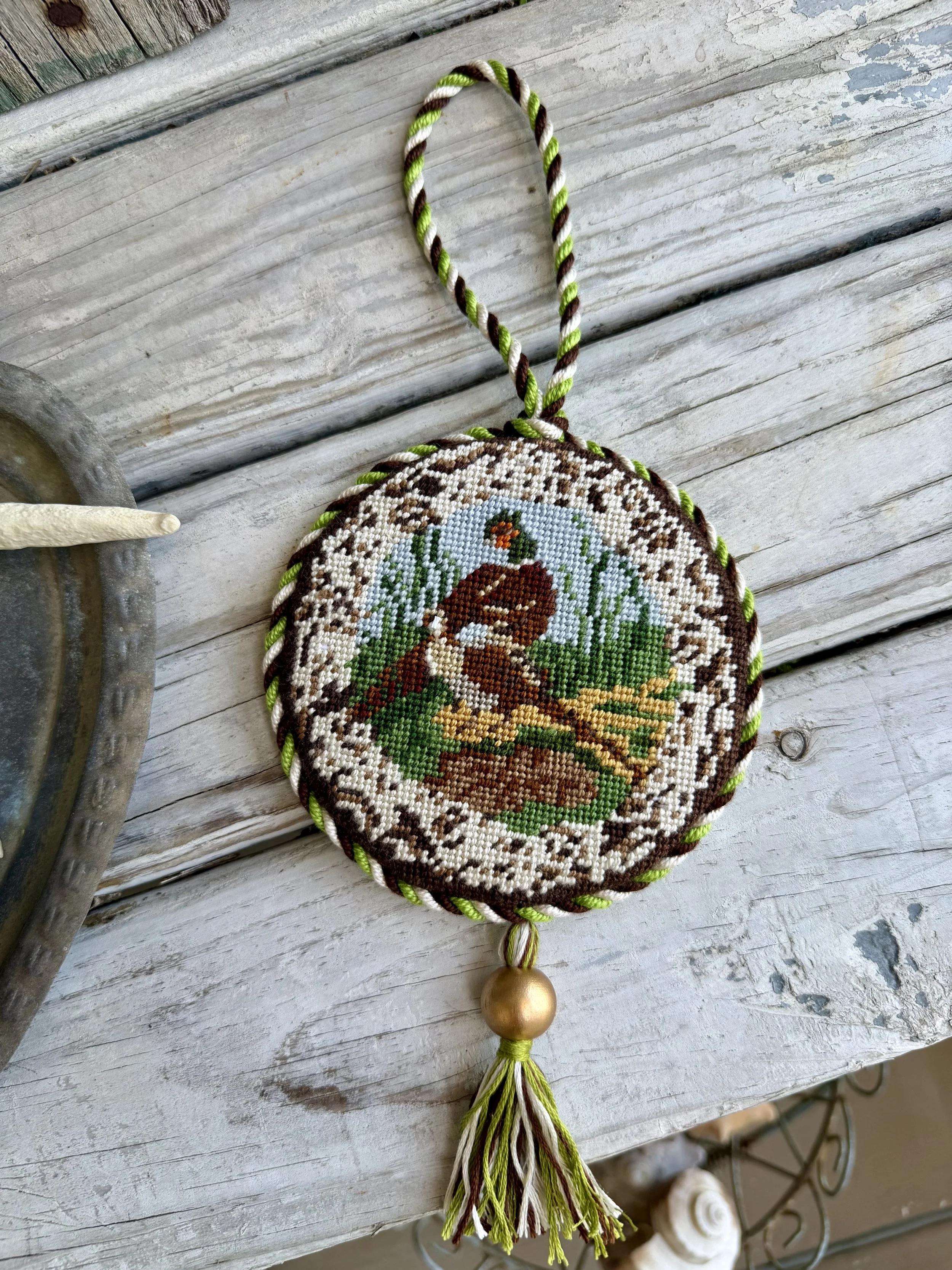 Round Needlepoint Ornament with custom cording & tassel - Finished by The Salty Stitchery