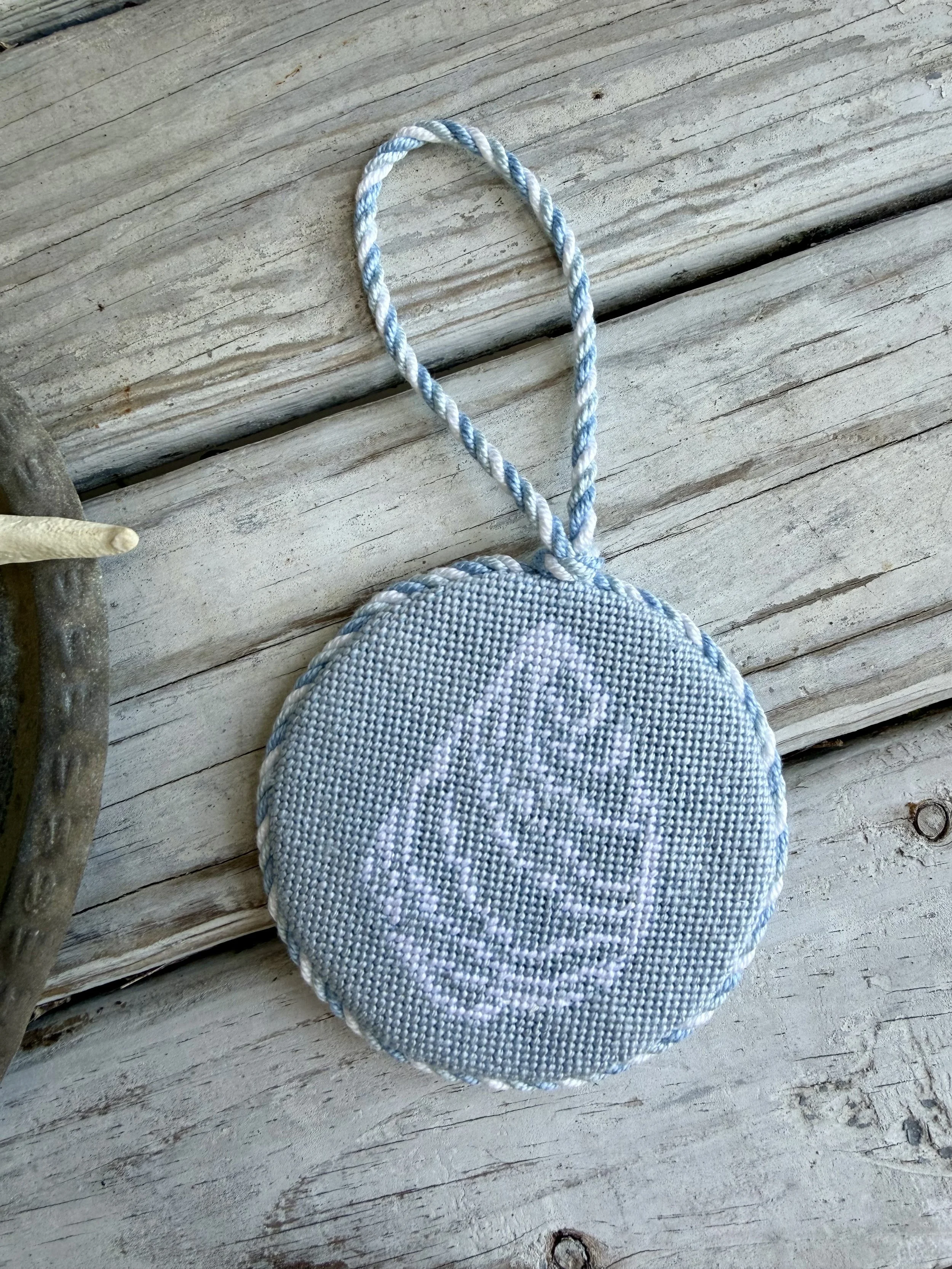 Round Needlepoint Ornament with custom cording  - Finished by The Salty Stitchery
