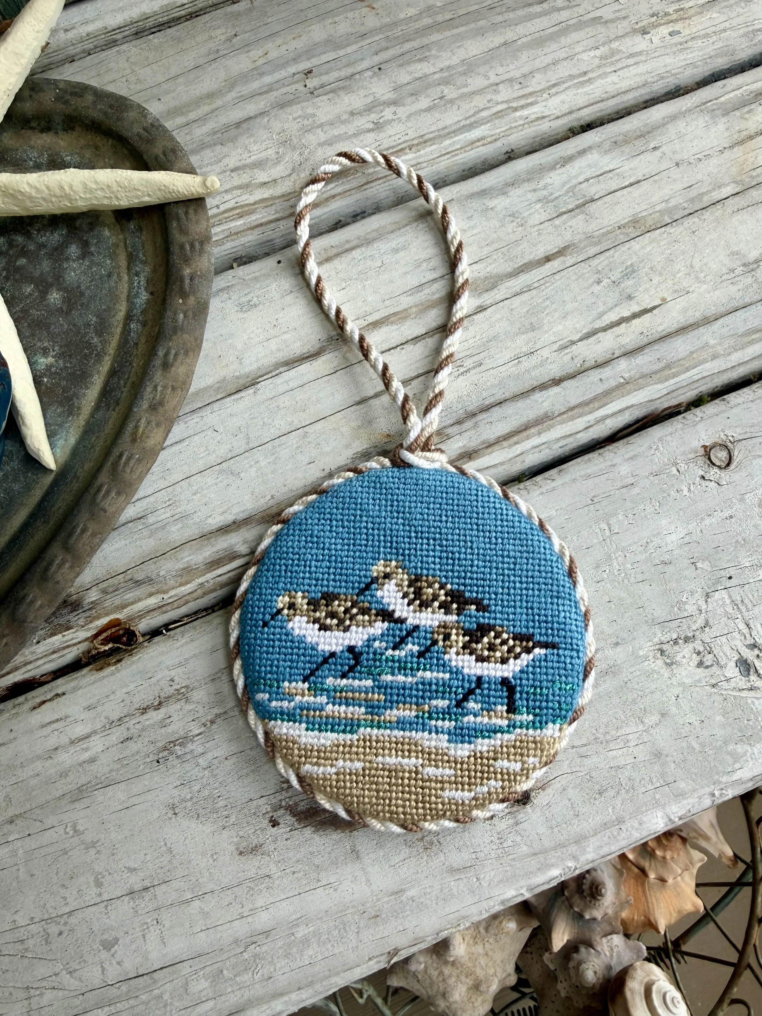 Round Finished Needlepoint Ornament with custom cording. Sandpiper Trio hand stitched Finished with The Salty Stitchery