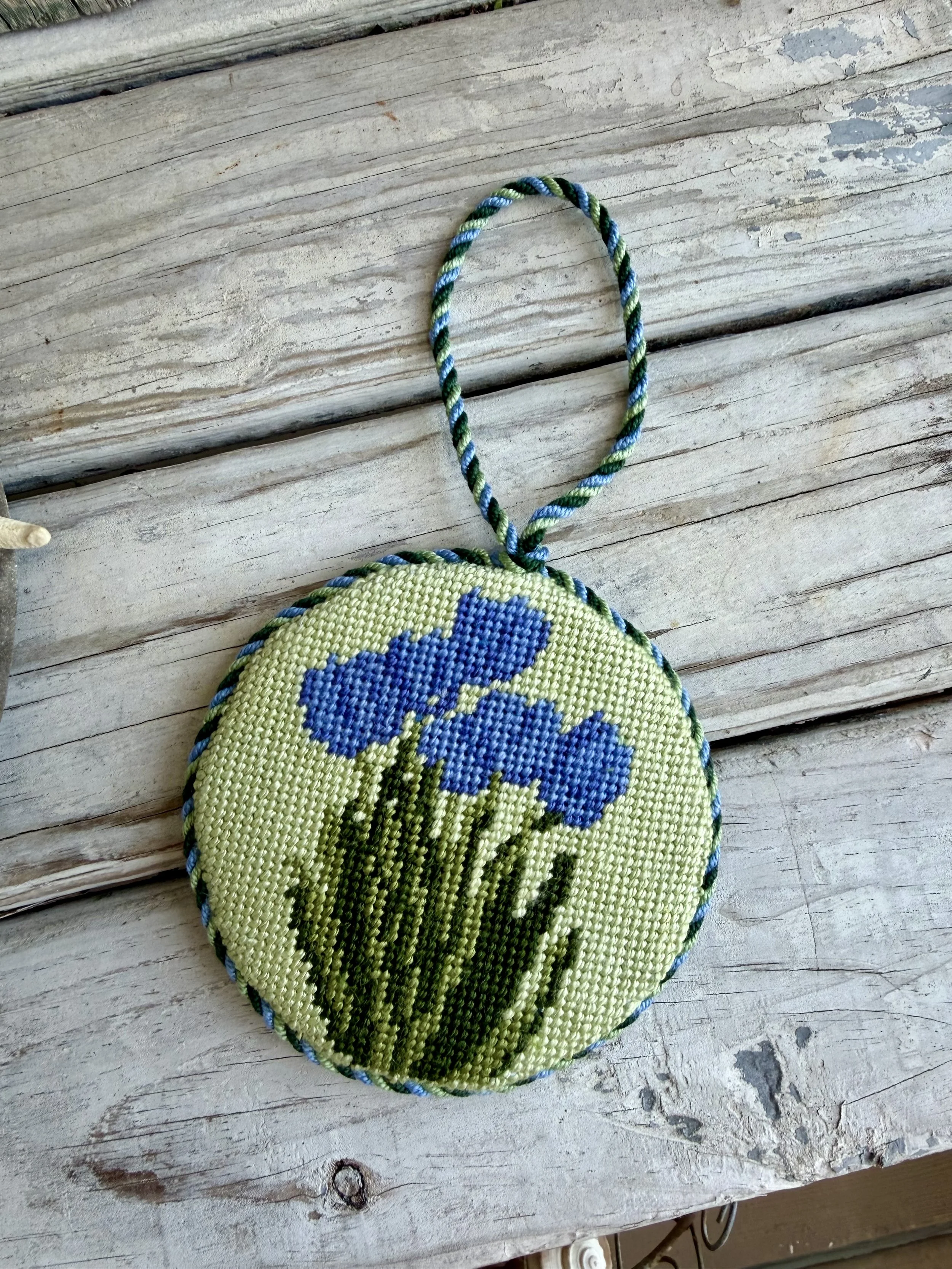 Round Needlepoint Ornament with custom cording  - Finished by The Salty Stitchery