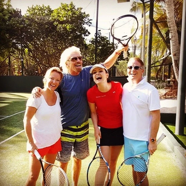 Aynsley Damery and Sir Richard Branson playing tennis on Necker Island