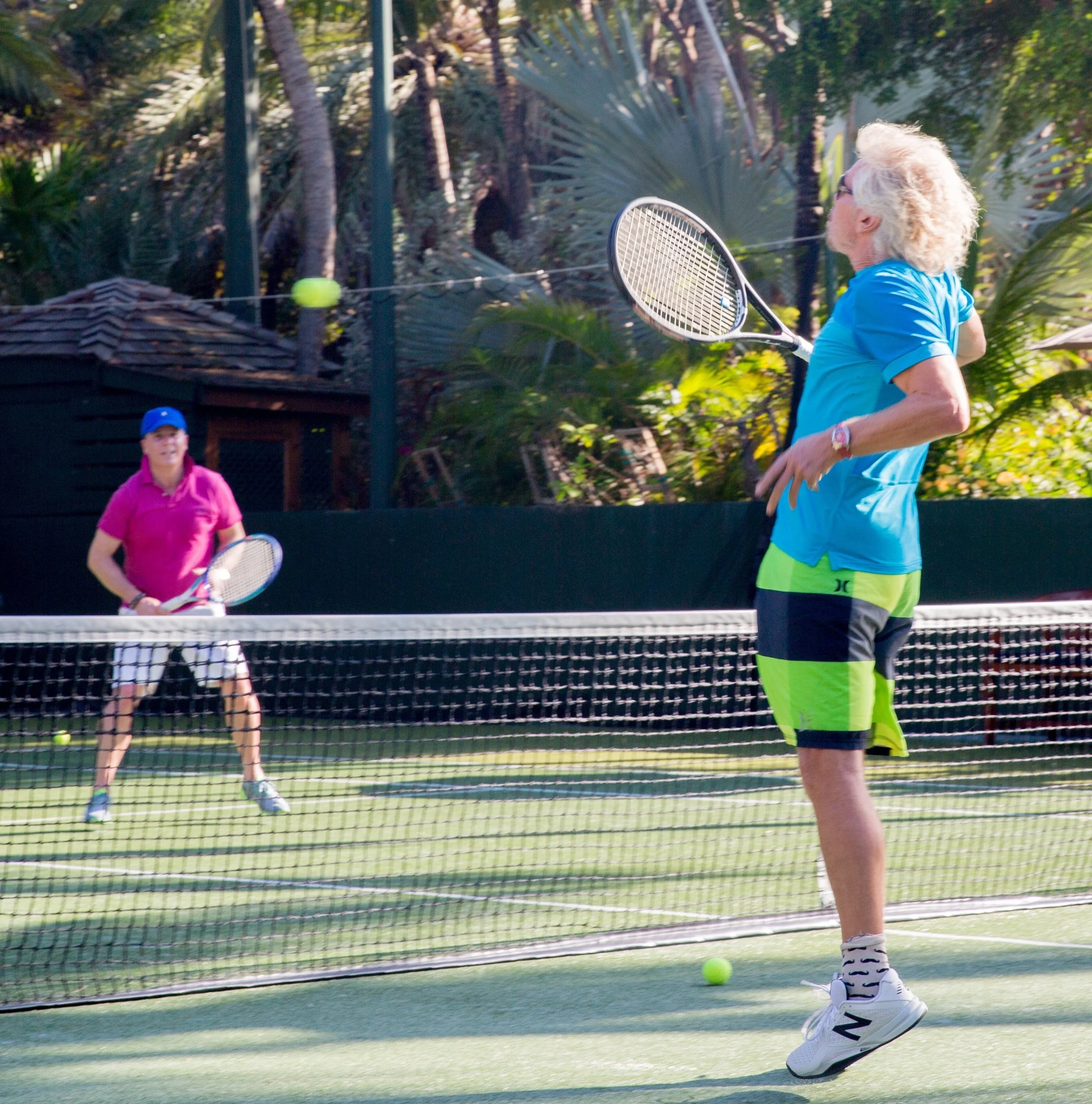 Aynsley Damery and Sir Richard Branson playing tennis on Necker Island