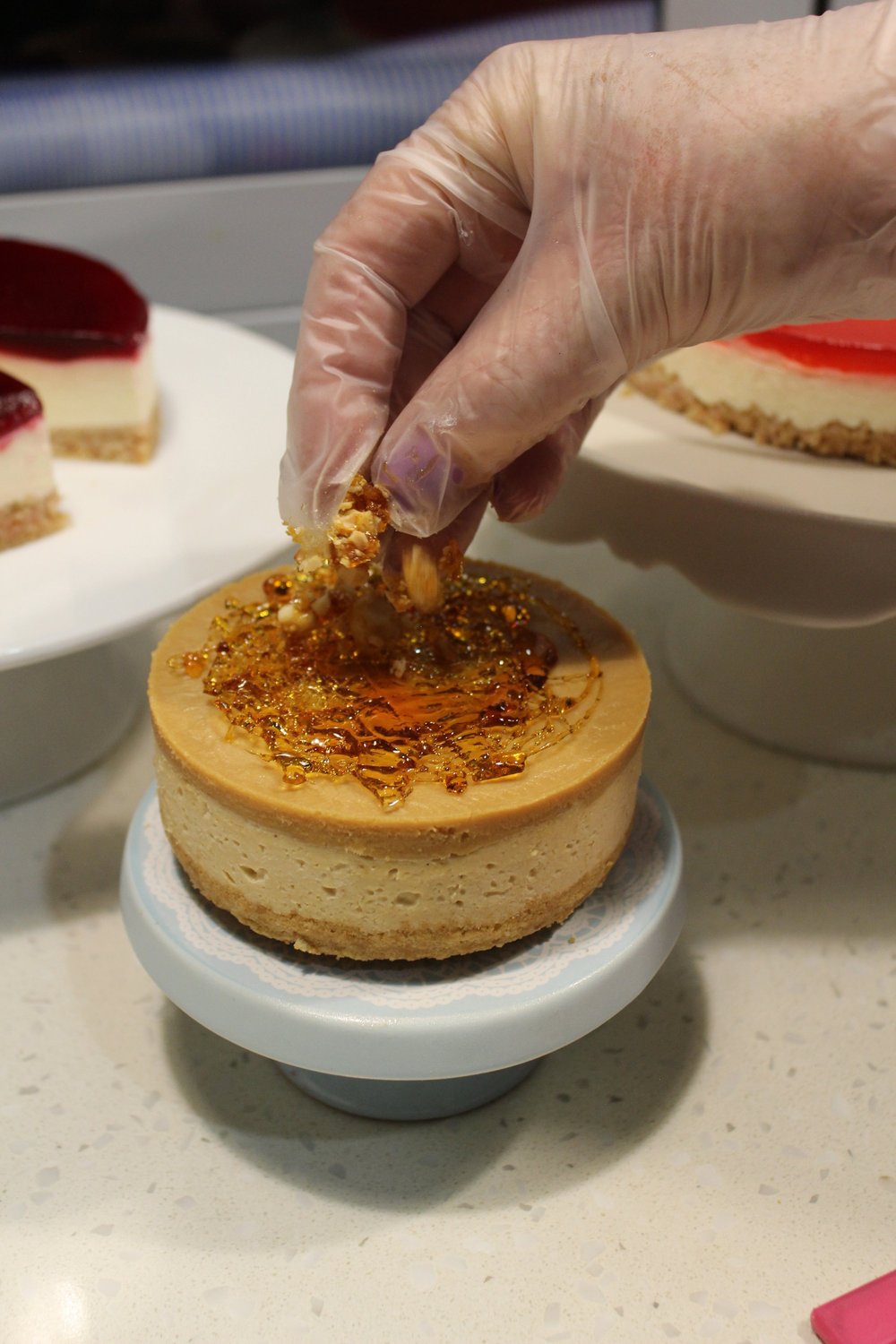 Lactose-free caramel cheesecake finished with shards of golden toffee