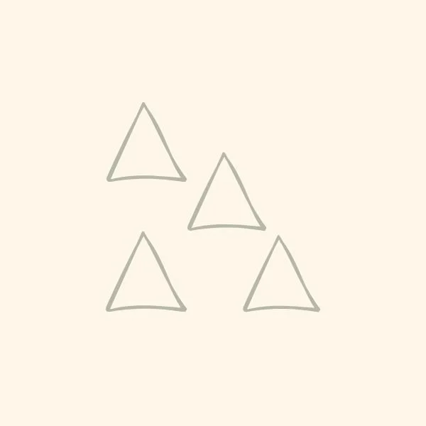 Four simple, hand-drawn triangles on a plain background.