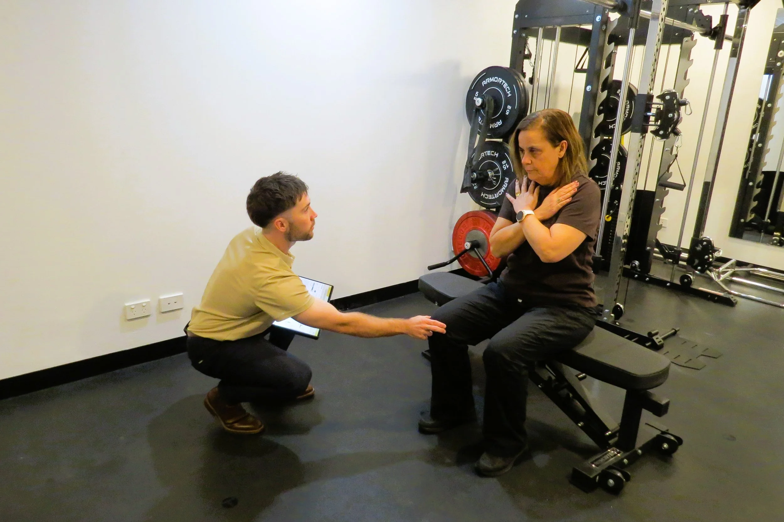 Exercise physiologist helping a patient recover from their cancer treatment through income protection