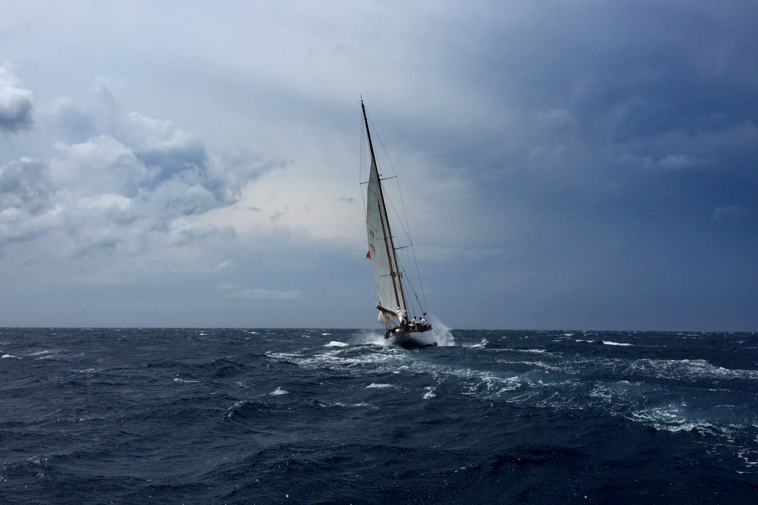 Sailboat in a windy open ocean