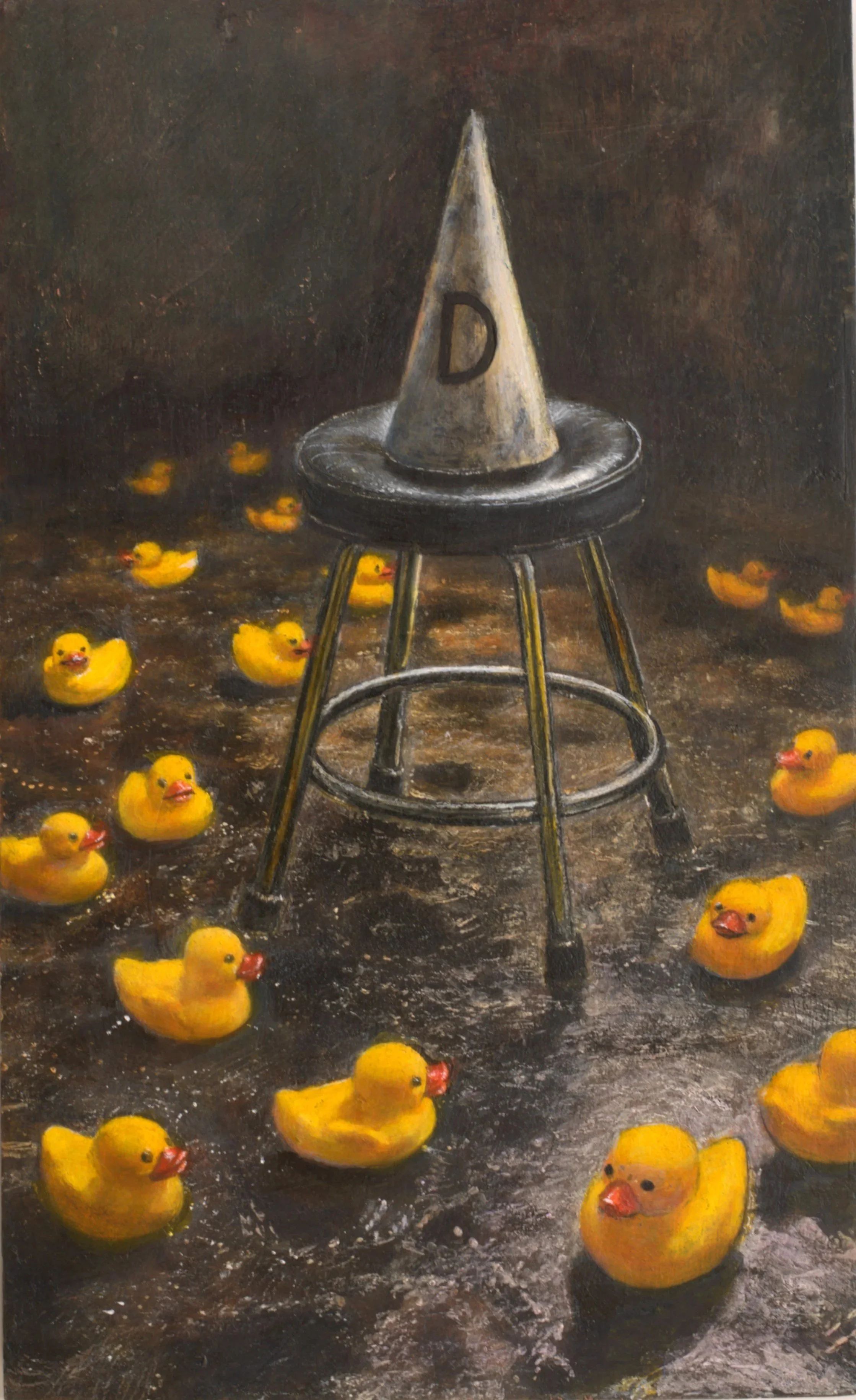 A painting of a conical hat with the letter 'D' on it, placed on a stool. Multiple yellow rubber ducks are scattered around the dark, textured surface.