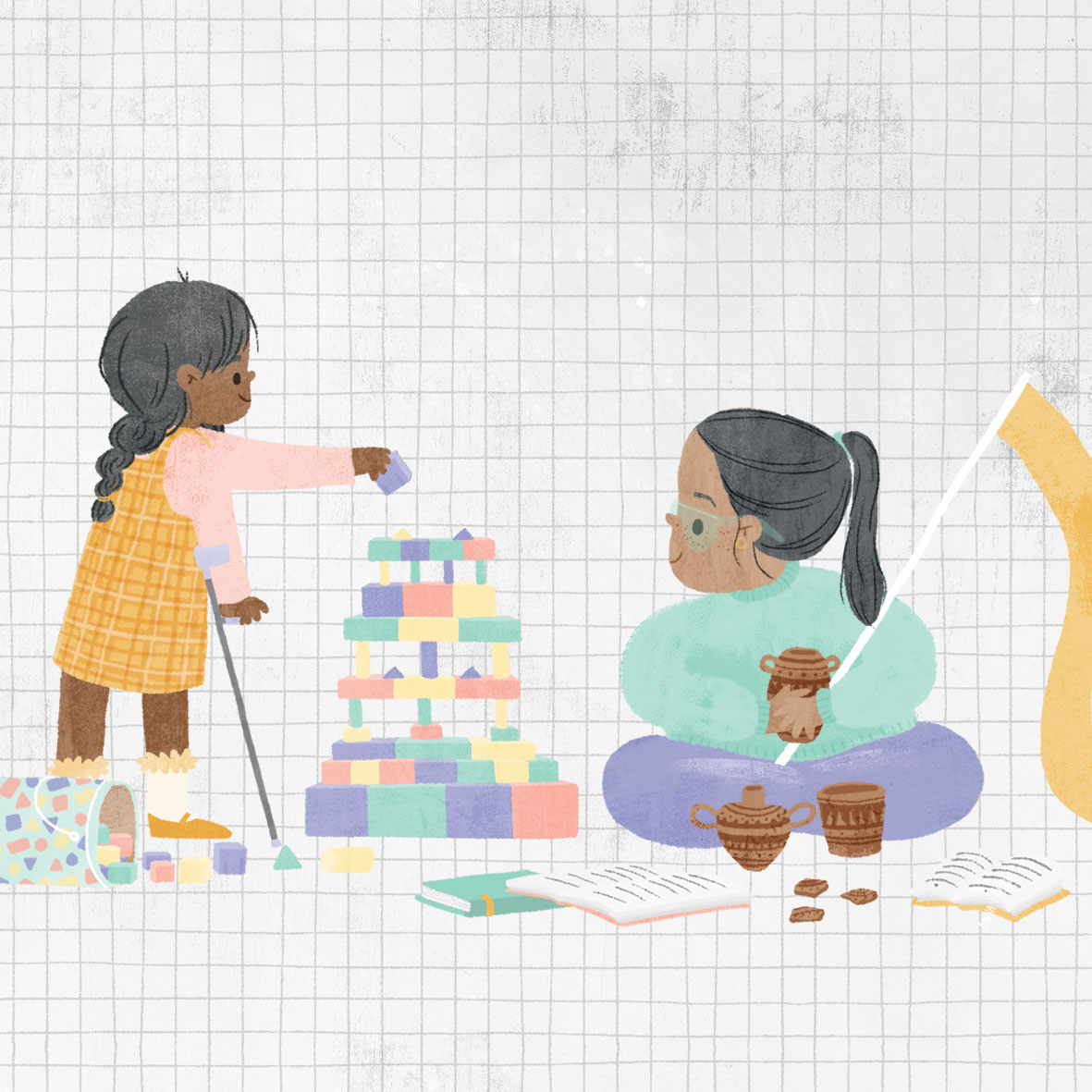 Two women playing and building with colorful blocks on a grid background. One woman is seated cross-legged, holding a block, while the other woman is standing and placing a block on a tower, with snacks and books nearby.