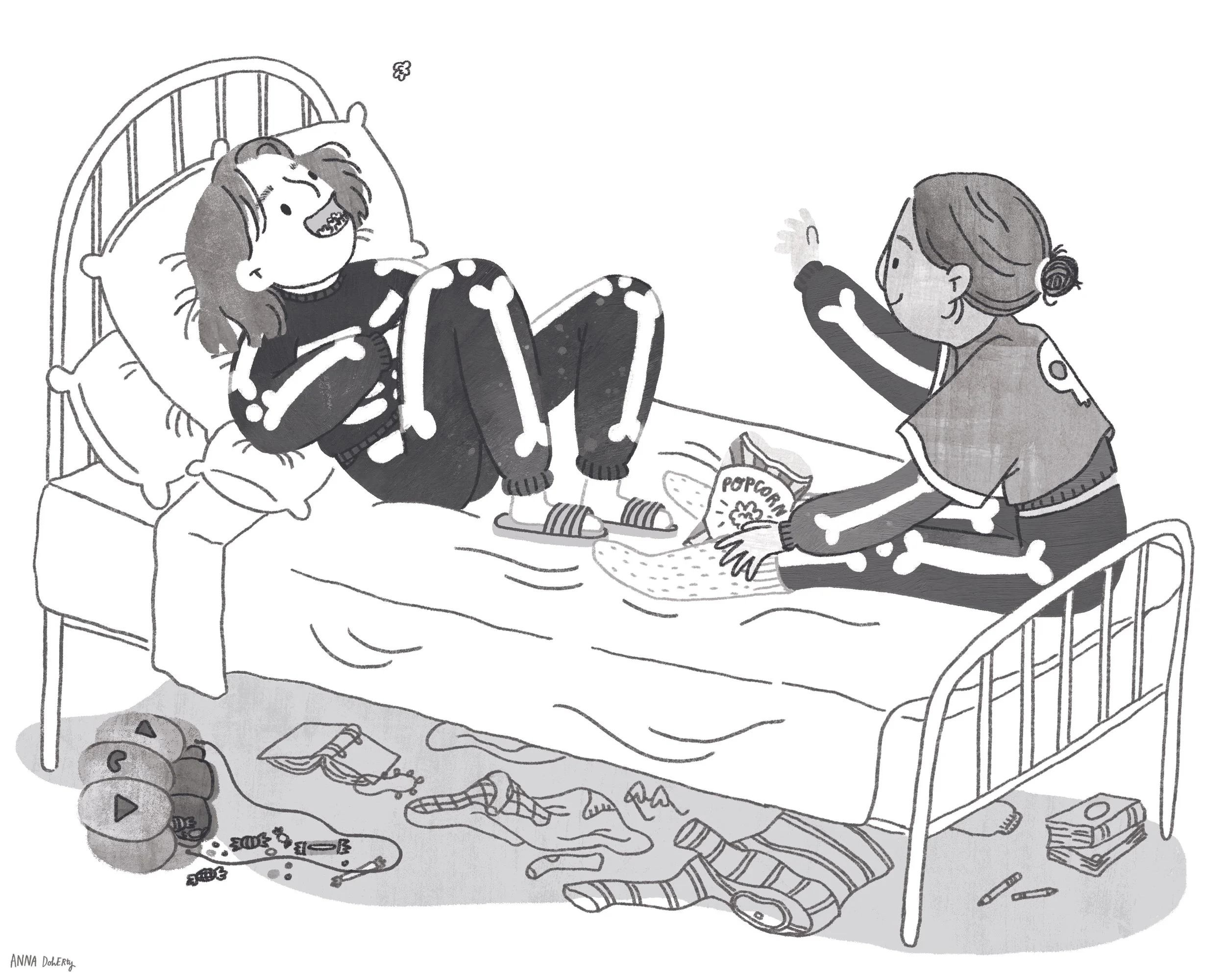 Black and white drawing of two girls in skeleton halloween costumes on a bed. One throws popcorn into the other one's mouth. At the bottom of the illustration, a pumpkin spills trick or treat sweets on the floor.