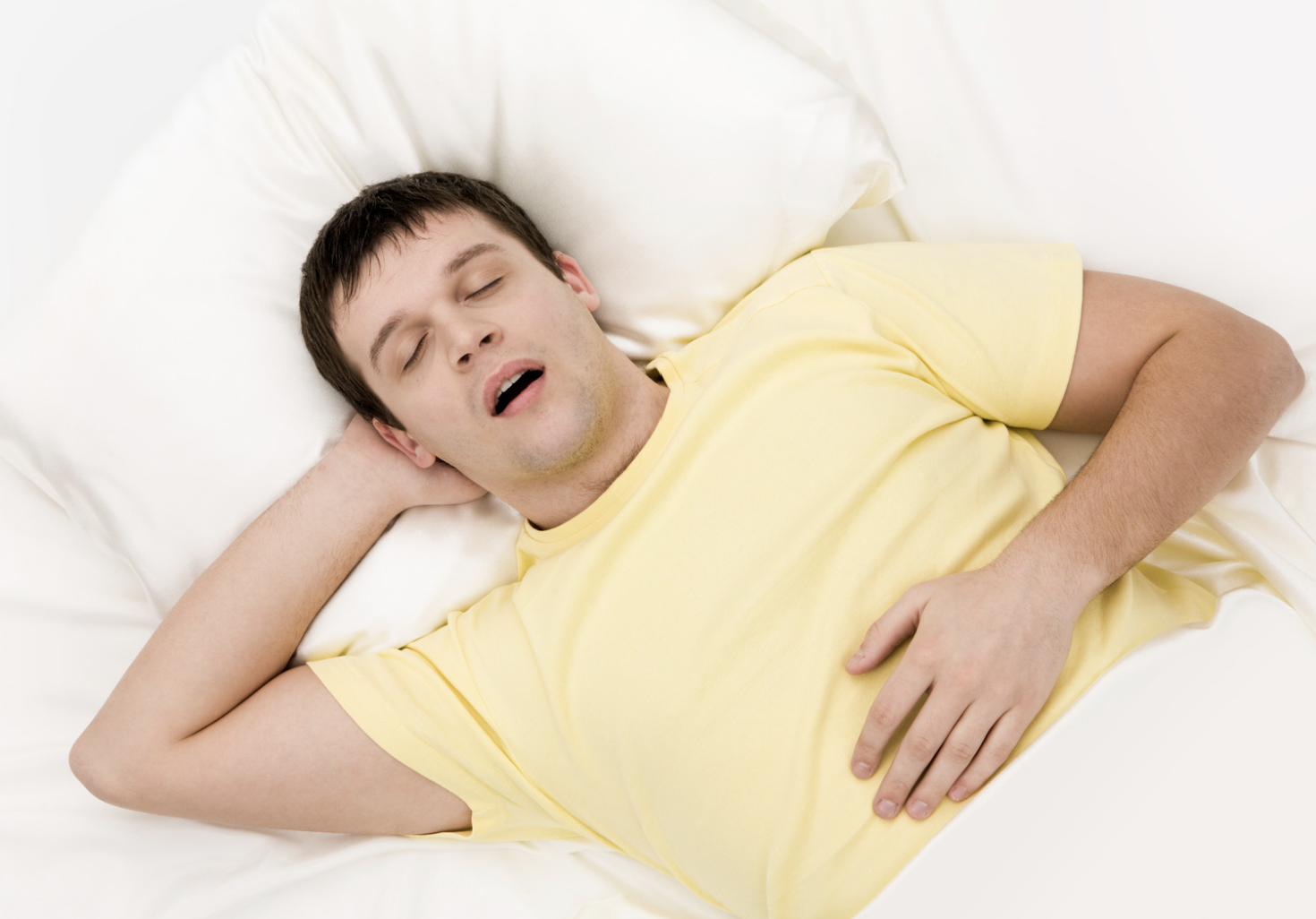 man snoring on his back sleeping with a dry mouth and snoring