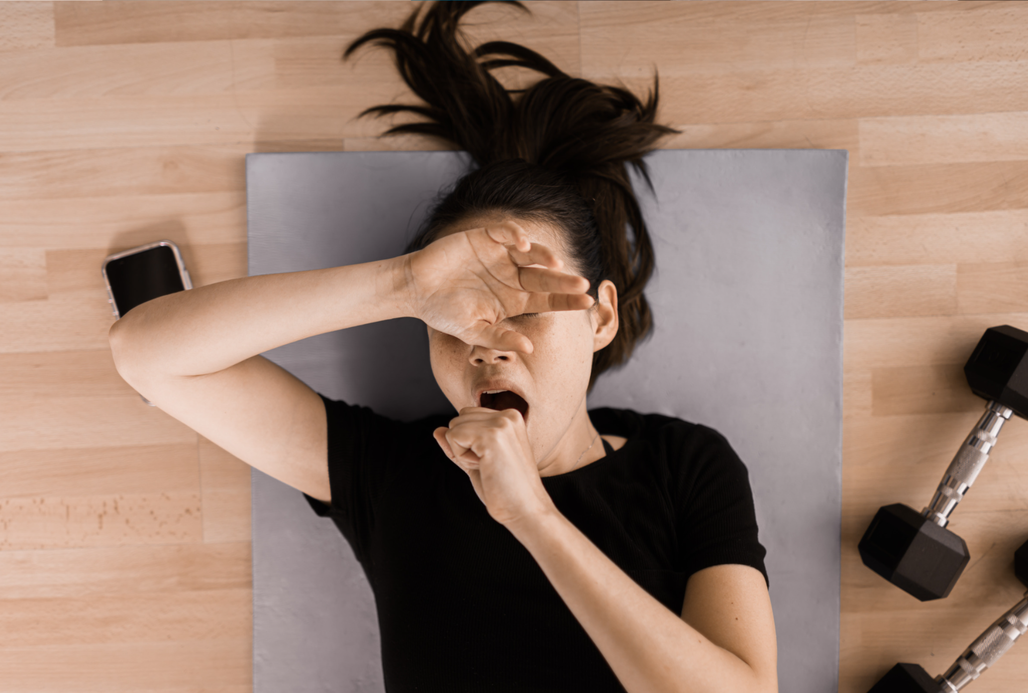 a lady yawning during exercise, is she tired or is it normal, this blog answers this questions for our dental sleep medicine patients