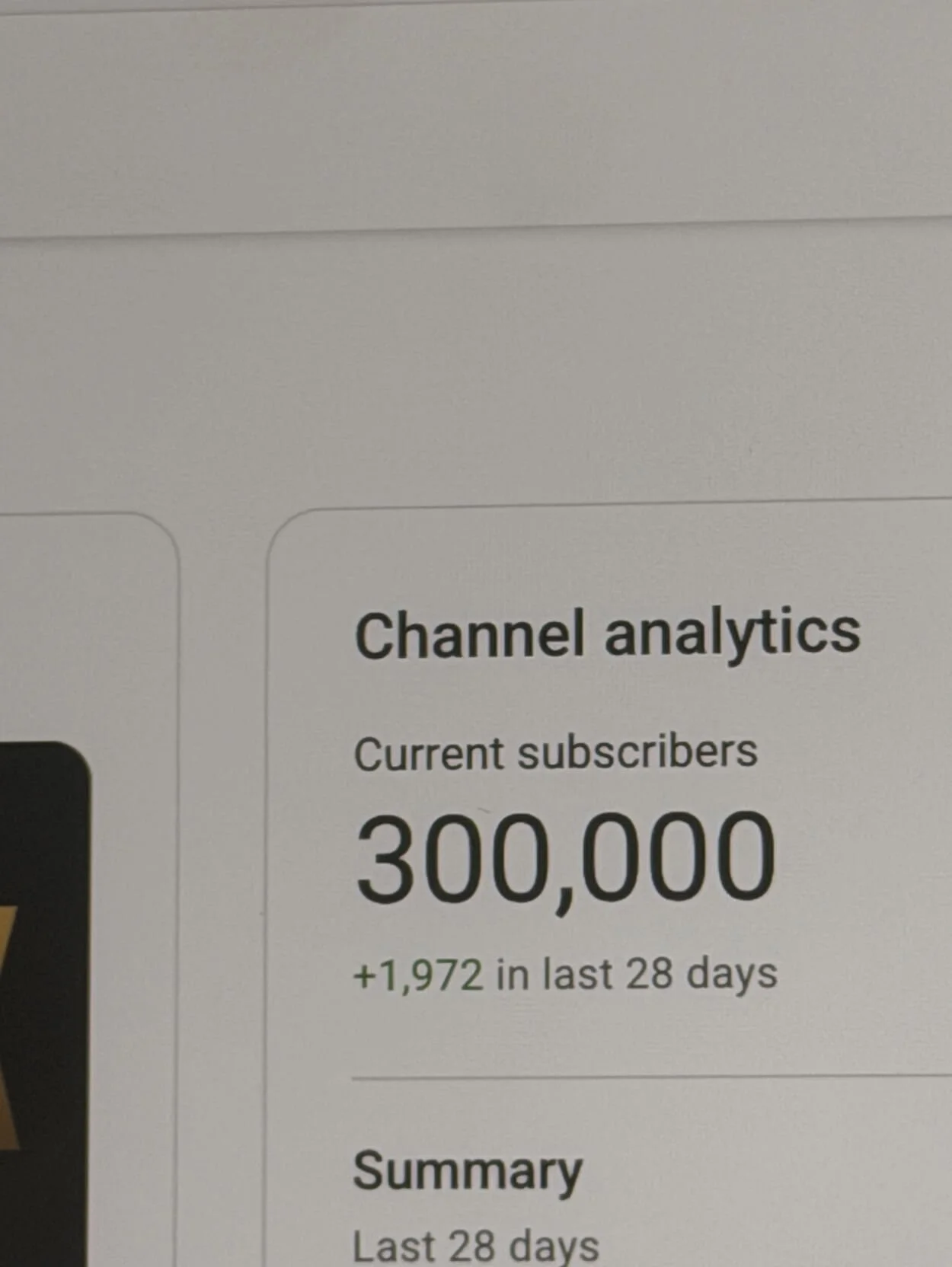 Screenshot of a YouTube analytics page showing 300,000 current subscribers, with recent growth of 1,972 in the last 28 days.