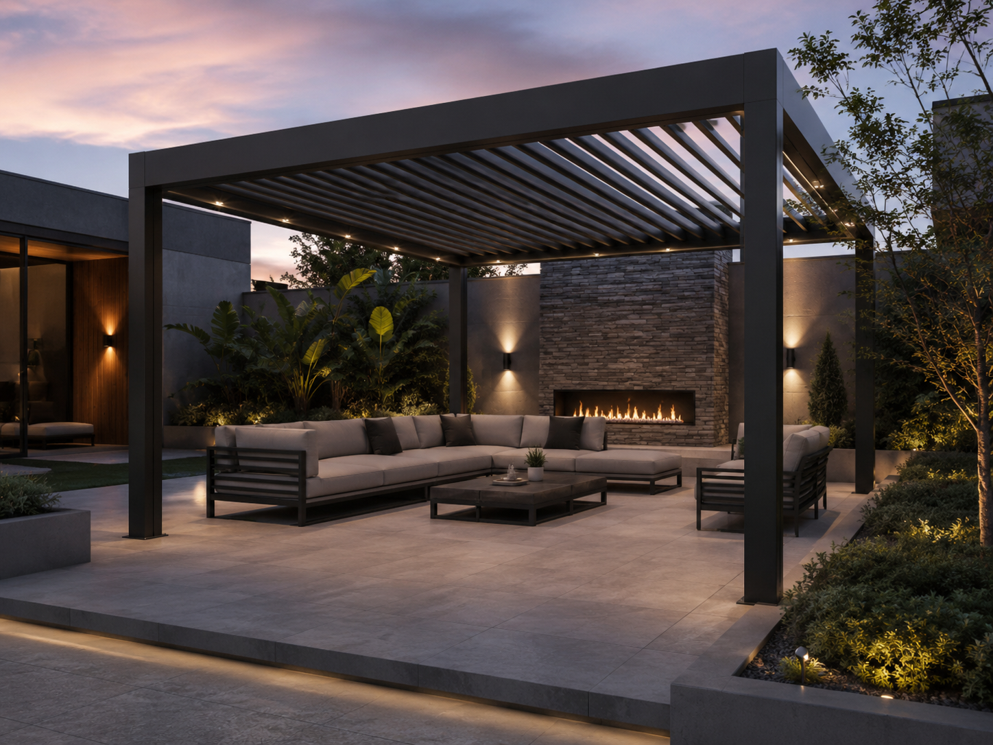Modern outdoor patio with a pergola, L-shaped sofa, fire feature, and lush greenery, dusk lighting, and a sunset sky.
