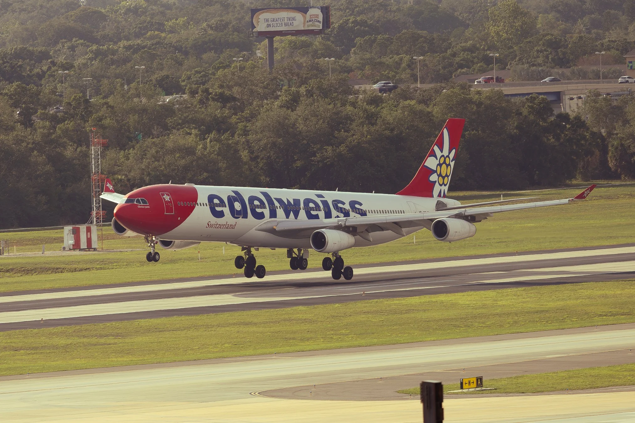 Edelweiss Airbus A340-300 arriving on runway 18R from Zürich, Switzerland