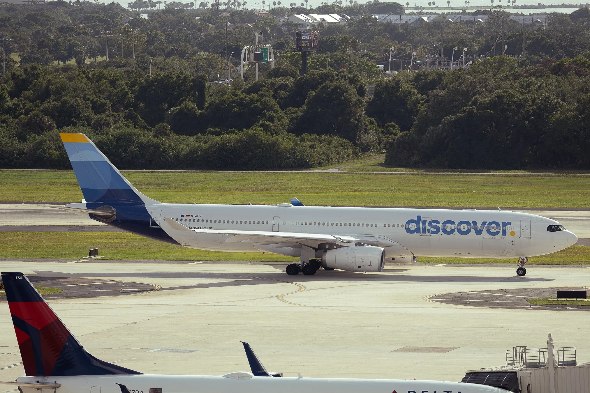 Discover Airlines Airbus A330-300 taxing out to runway 18R for departure to Frankfurt, Germany