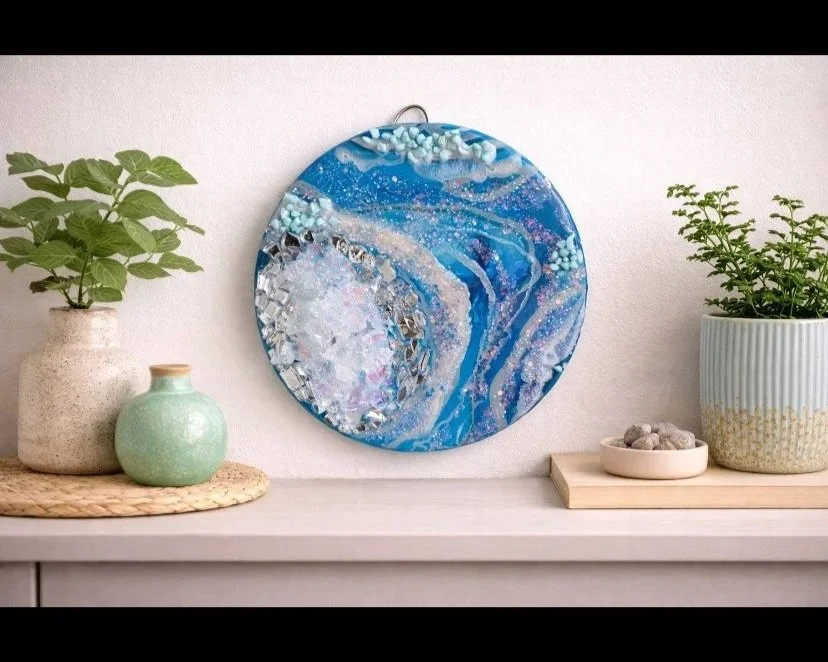 Rocky shore

This is a 6 inch wood panel with acrylic paint, resin fire glass, glitter and rocks. 