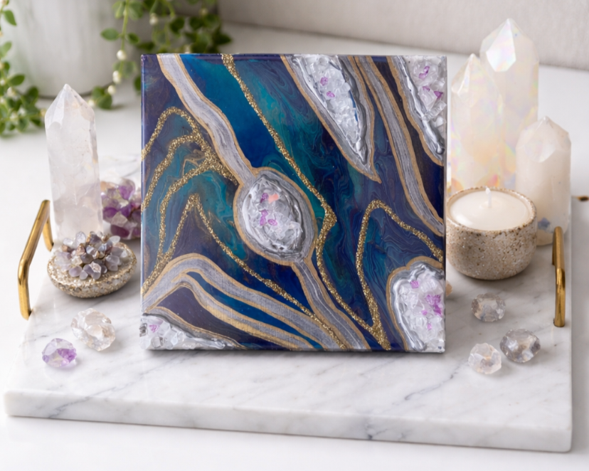 Veins of gold

This is a 6 inch wood panel with acrylic paint, glitter, fire glass and resin. 