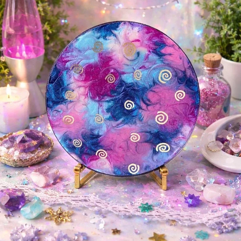 Cosmic confetti

This is a 12 inch wooden panel with mica powder, pigment, marker and resin