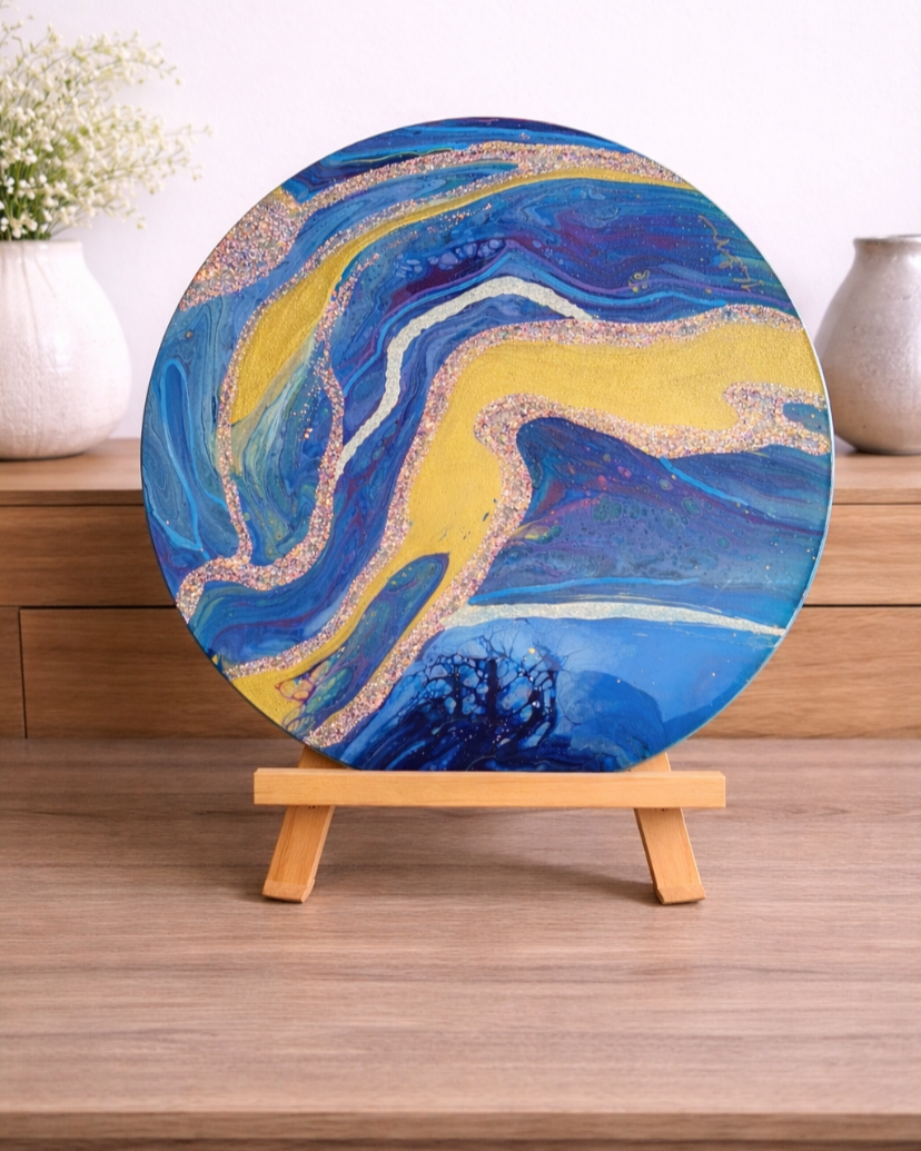 Golden River runs through

This is a 14 inch round canvas with acrylic paint, glitter and resin. 