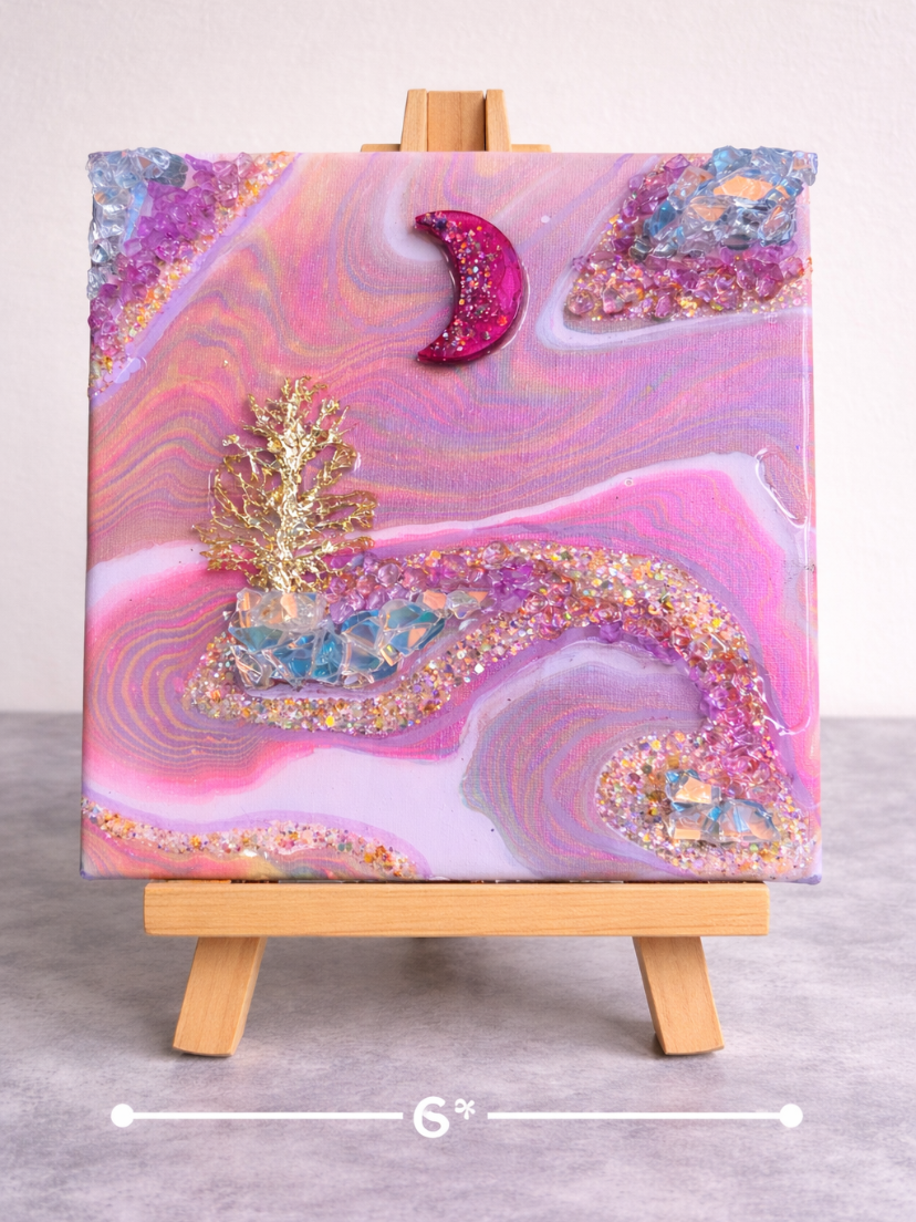 Blushing moon

This is a 6 by 6 inch canvas with resin, a tree, rocks, fire glass and glitter. 