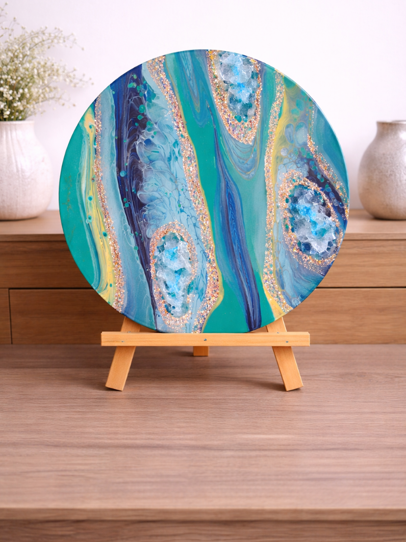 Magic Earth rocks. 

This is a 12 by 12 canvas with paint, fireglass, glitter and resin. '

