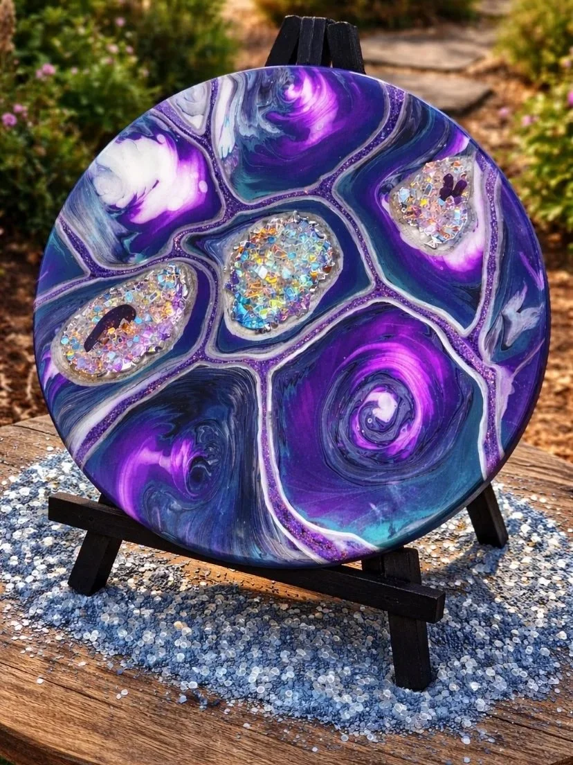Wizard of AHHHH

This is an 18 inch wood round with acrylic paint, glitter, marker, resin, rocks, fire glass, crystals and an agate slice.  