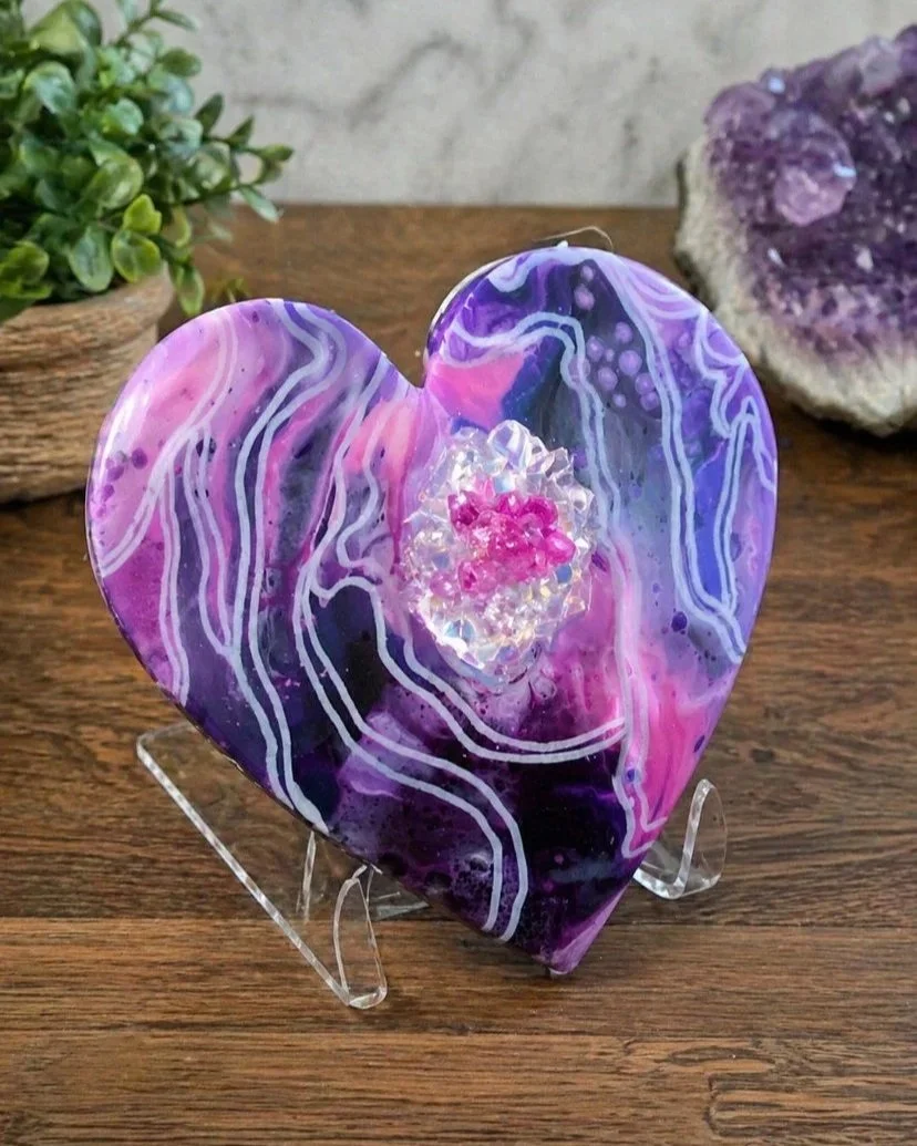 Galactic heart

This is an approximately 7 inch across wooden panel heart with paint, mica, markers, resin, crystals and fireglass.  