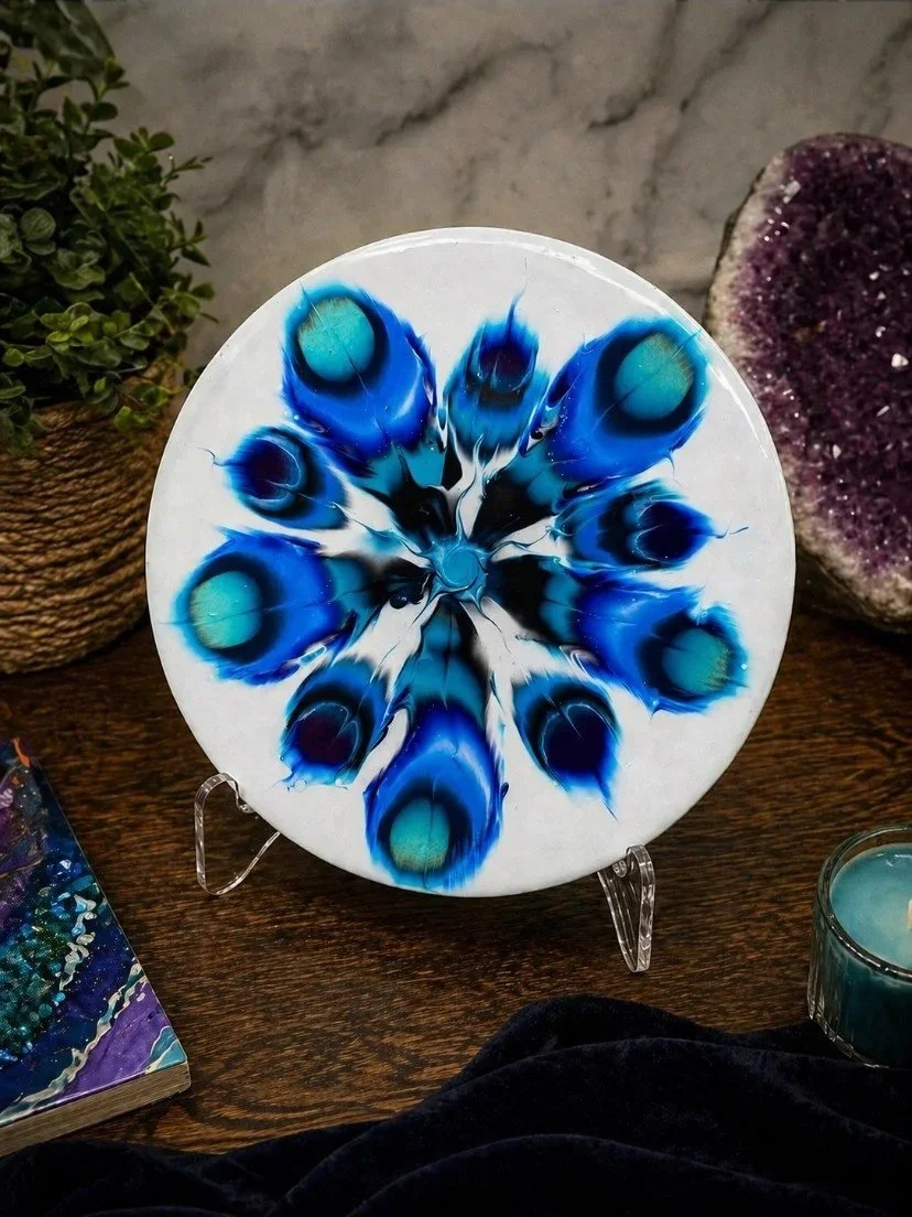 Kaleidoscope. 

This is a 20 inch round wood panel with paint and resin.  