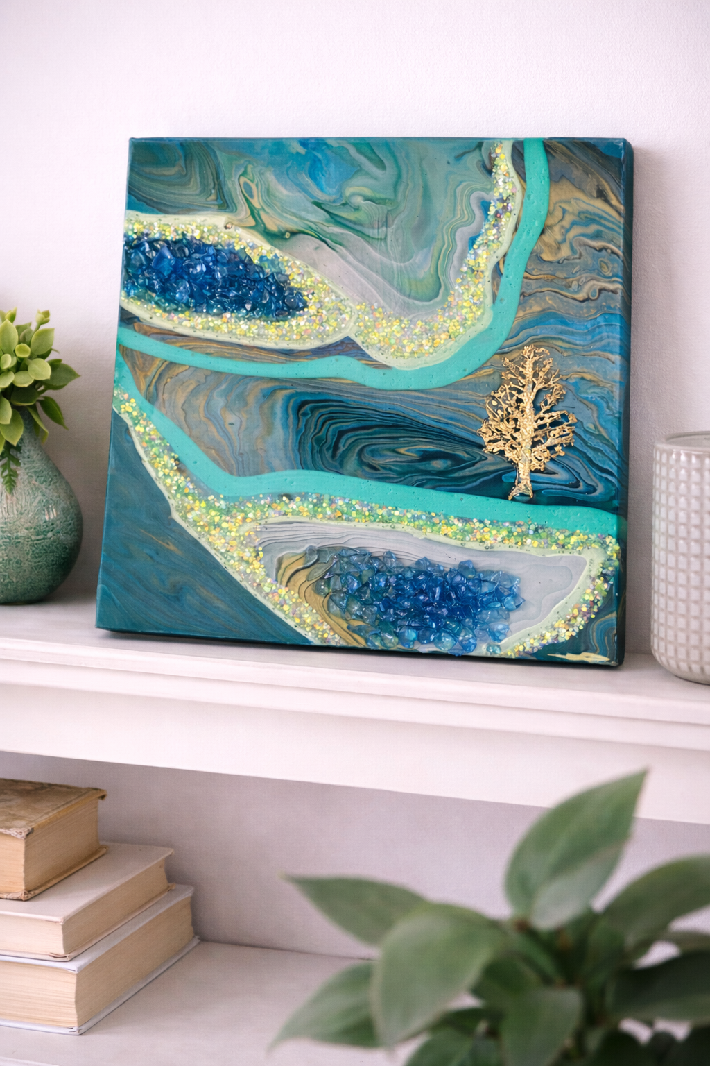 Fantasy Realm

This is a 10 by 10 wood panel with paint, fireglass, glitter, a resin tree, resin and mica.  