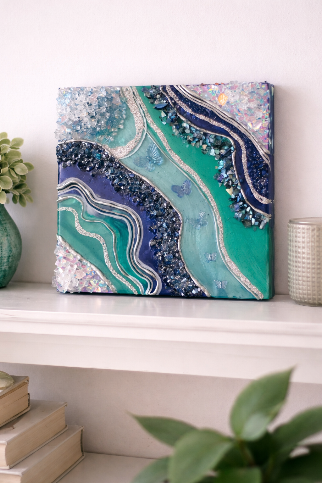 Migration

This is a 12 inch wood panel with paint, mica, pigment, resin, markers, glitter, fire glass and butterflies. 