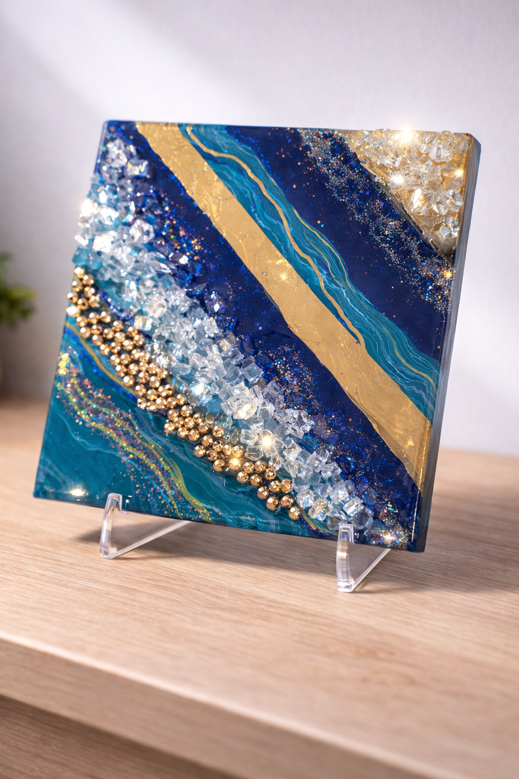 Fool's gold

This is a 6 inch by 6 inch canvas with paint, resin, beads, fireglass and marker. 