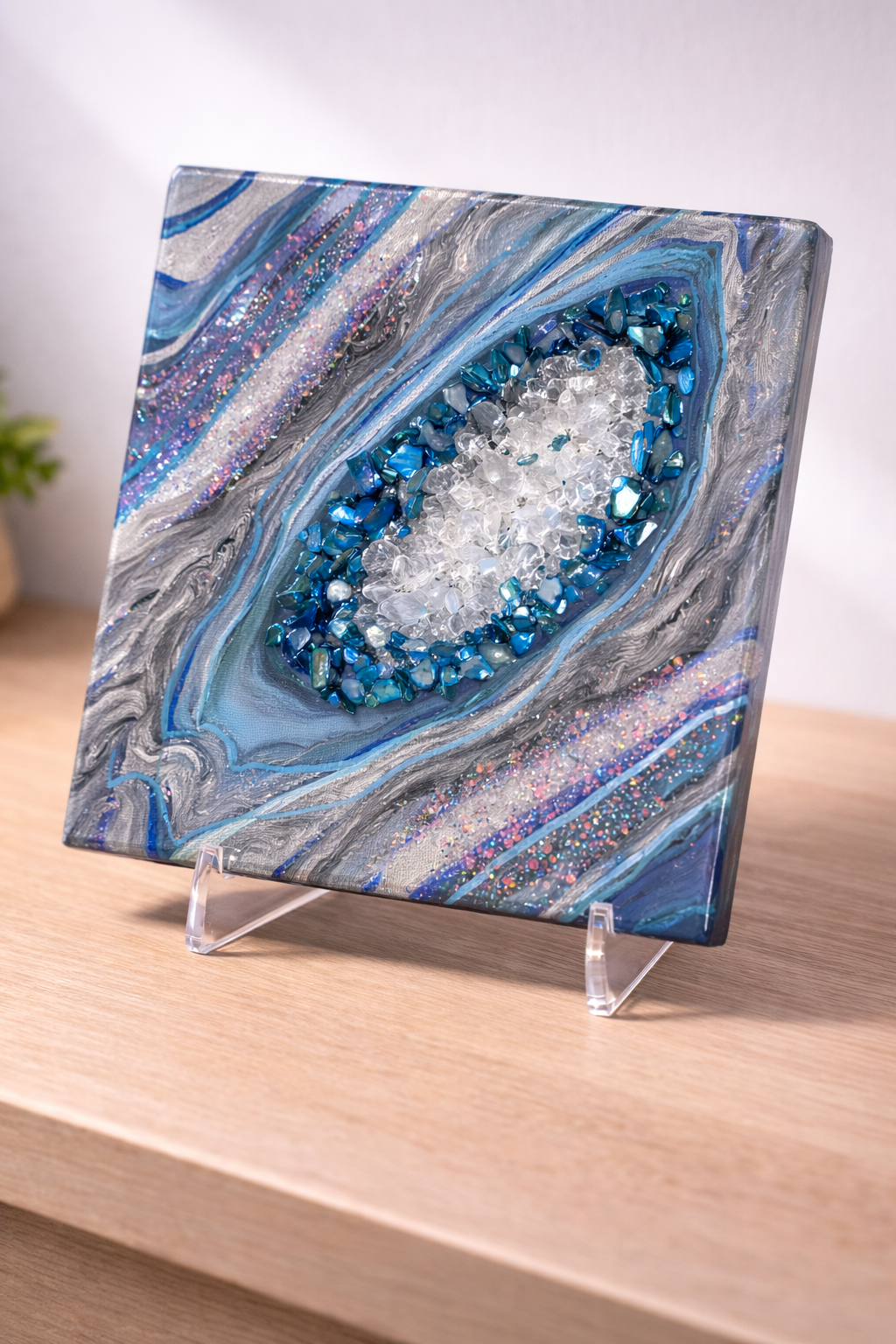 Glacita

This is a little glacier piece with paint, marker, rocks, fireglass, resin and glitter. 