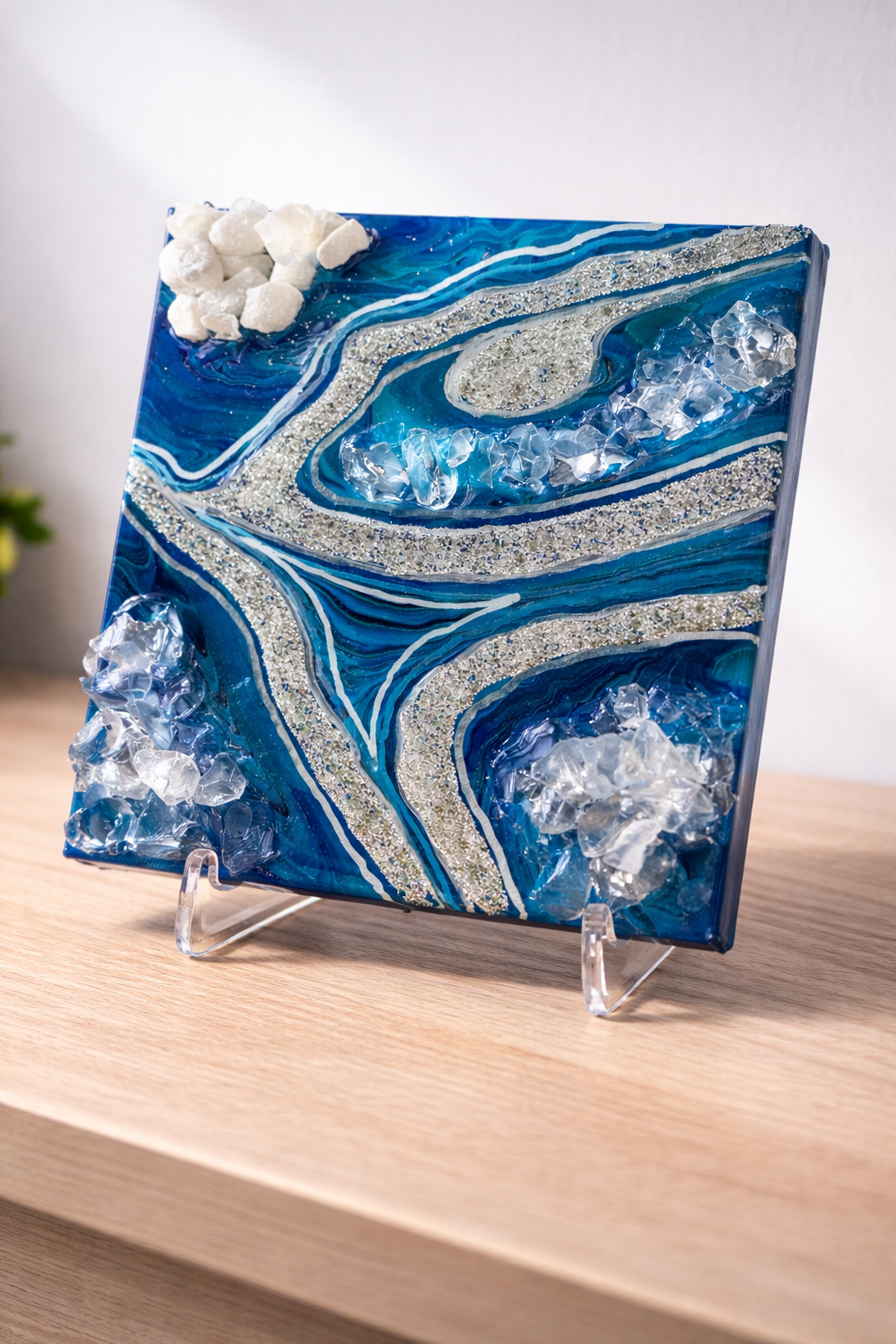 Frozen paths

This is a 6 inch by 6 inch canvas with paint, resin, glitter, rocks, fireglass and resin. 