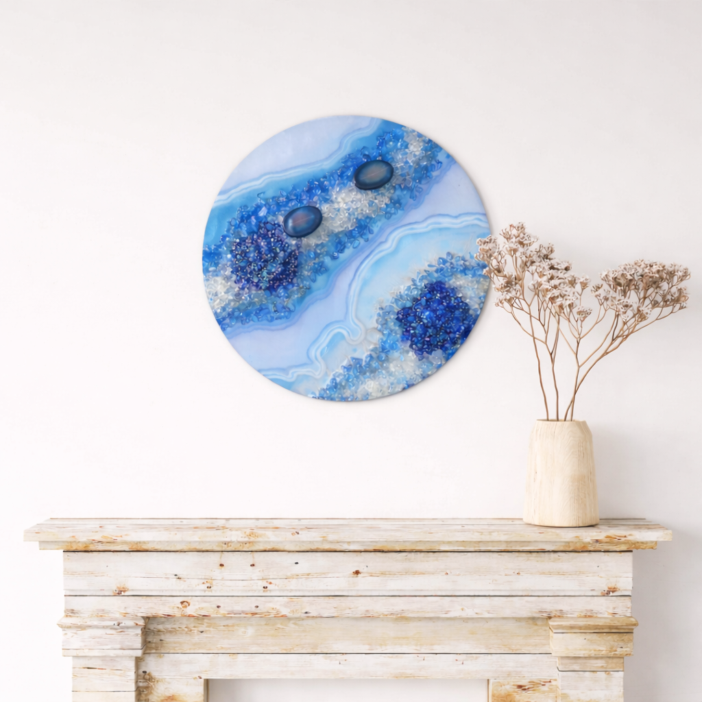 Topazia

This is a 12 inch wood round with mica, pigment, resin, fireglass, and rocks.  It also has blue resin crystal clusters