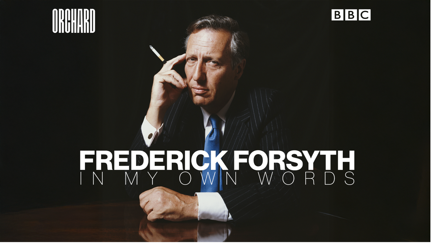 Promotional poster for Fredrick Forsyth's book 'In My Own Words' featuring a man in a suit sitting at a desk, holding a cigarette and touching his temple, with black background and text overlay.