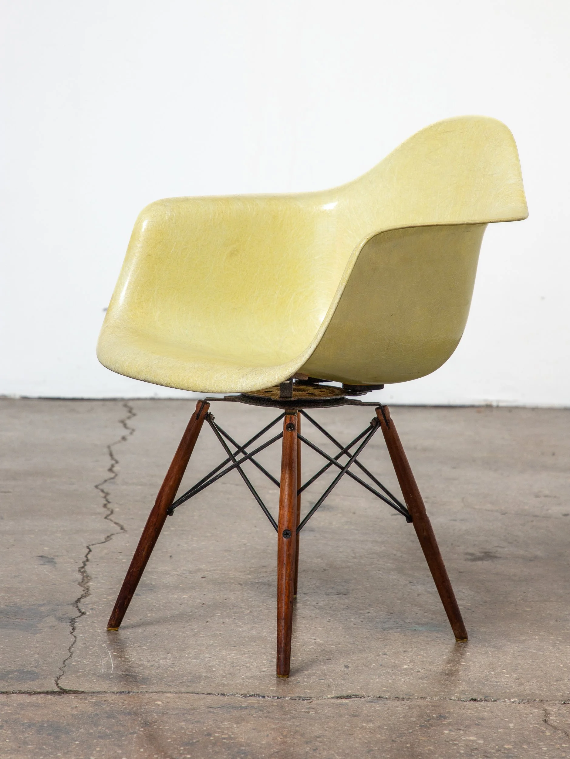 A first edition Eames chair with rope-edge, large glides and original swivel base..