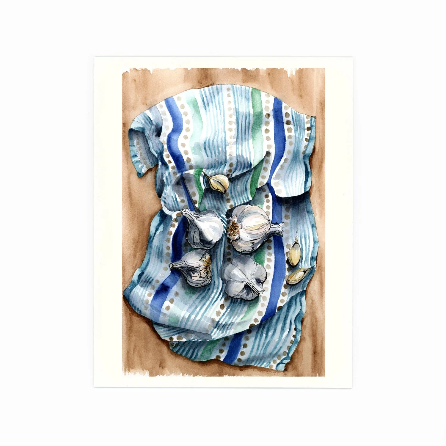 Watercolor painting of a bunch of garlic bulbs and garlic cloves on a colorful, striped cloth on a wooden surface.